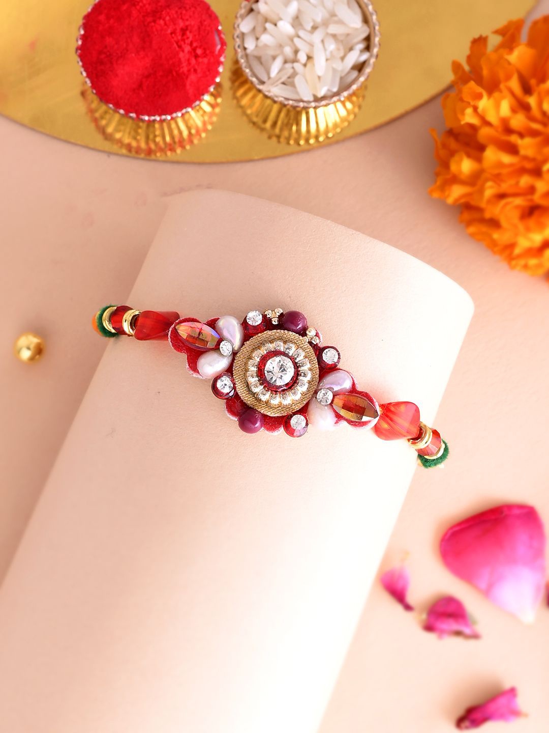 

Aapno Rajasthan Lord Ganesha Beaded Rakhi With Roli Chawal & Greetings Card, Red