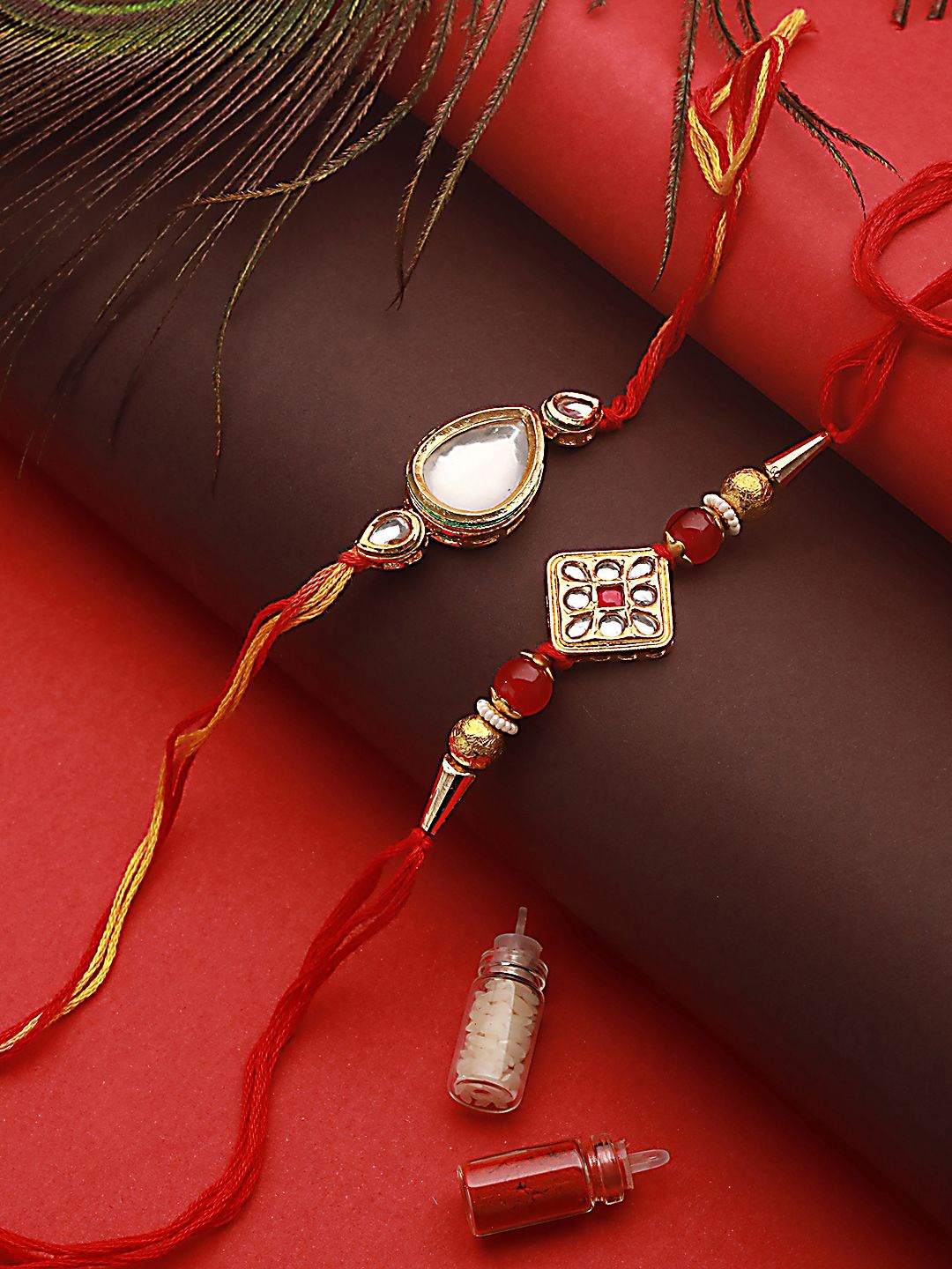 

Jazz and Sizzle Set Of 2 Kundan Studed & Beaded Rakhis With Roli & Chawal, Maroon