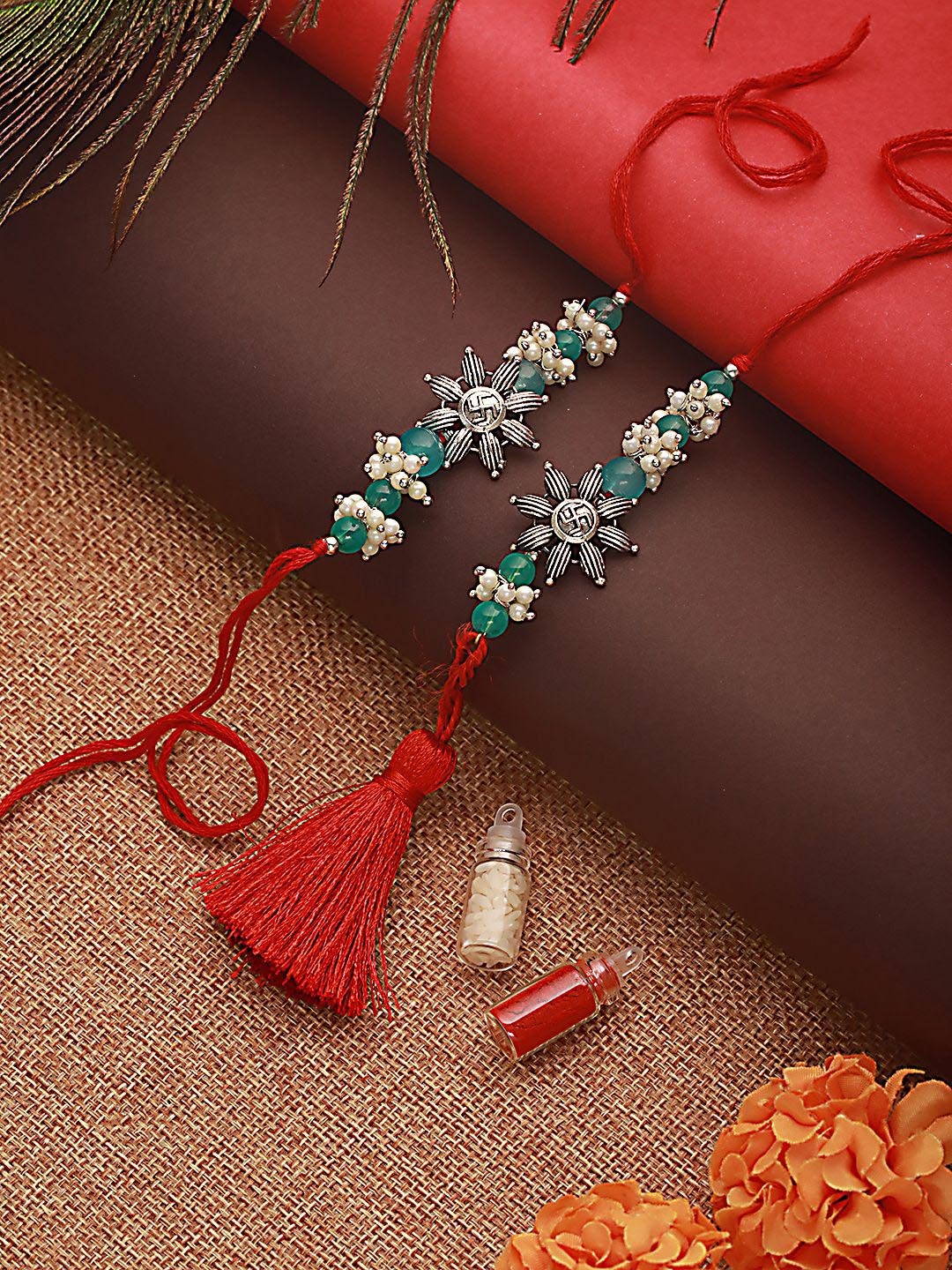 

Jazz and Sizzle Swastik Motif & Mogra Beaded Bhaiya Bhabhi Rakhi With Roli & Chawal, Red