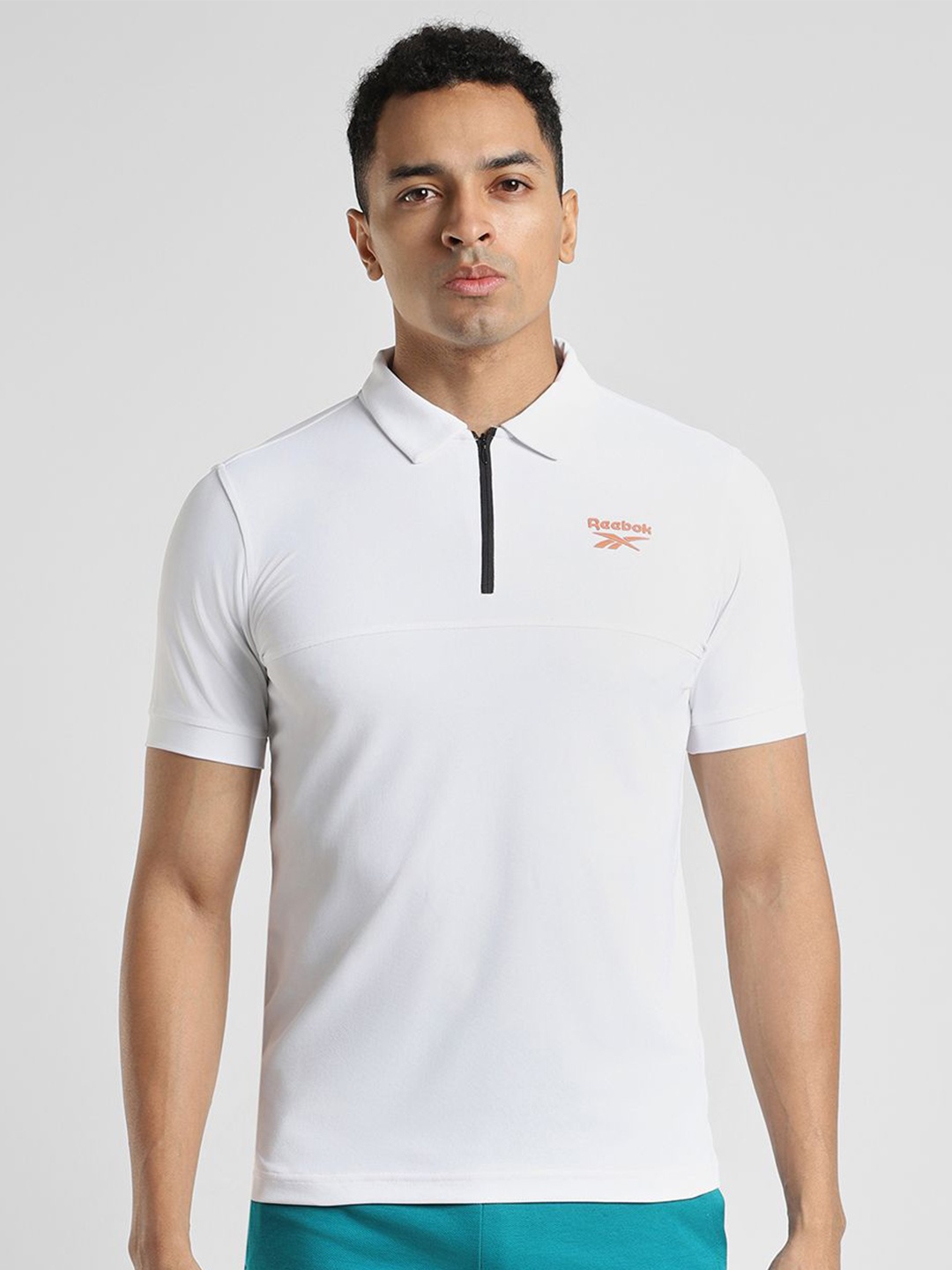 

Reebok Men Solid Polo Collar Slim Fit T-Shirt, White