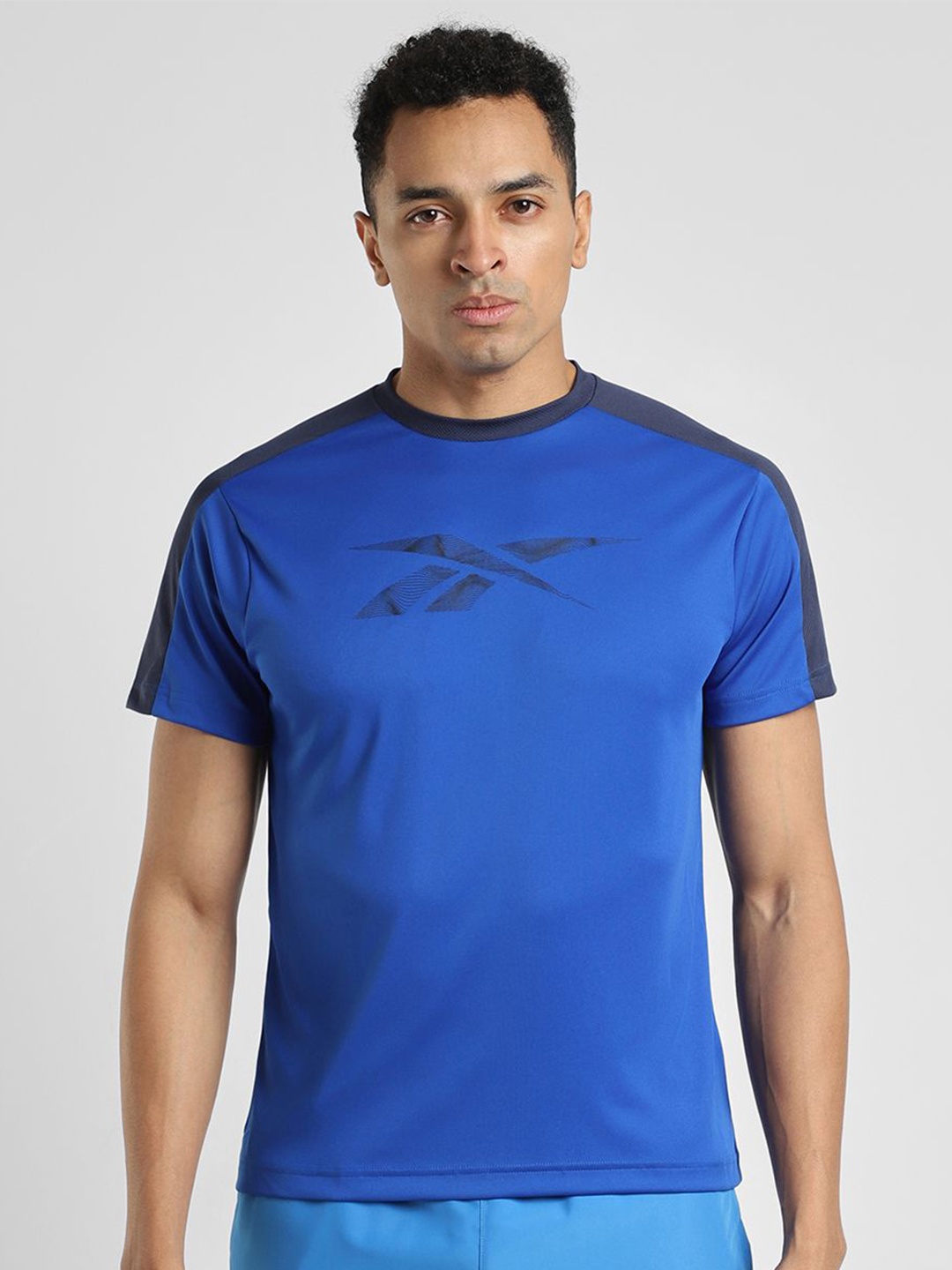 

Reebok Men Solid Round Neck T Shirt, Blue