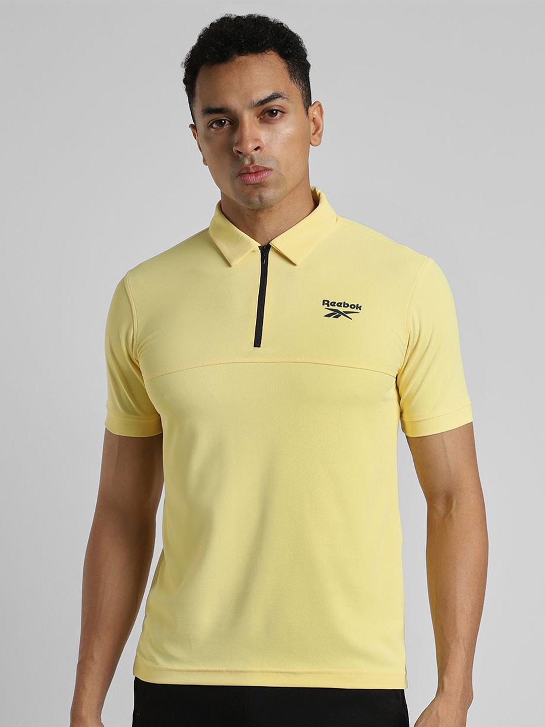 

Reebok Men Solid Polo Collar Slim Fit T-Shirt, Yellow