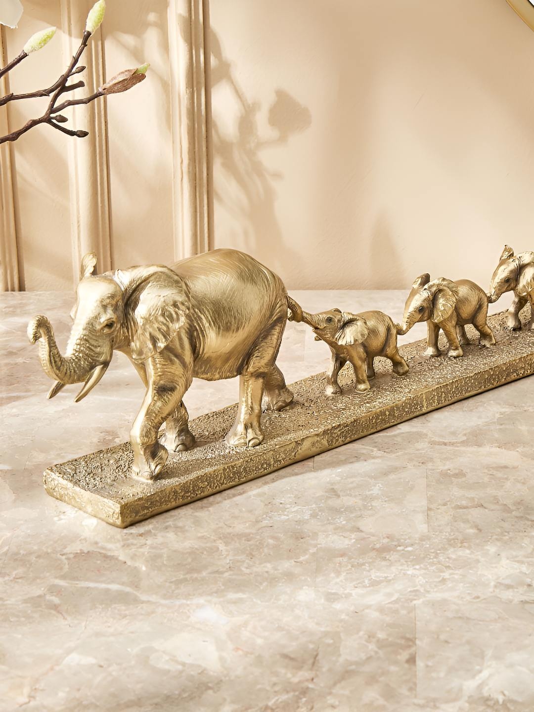 

Home Centre Gold Toned Elephant With Babies Figurine Showpiece