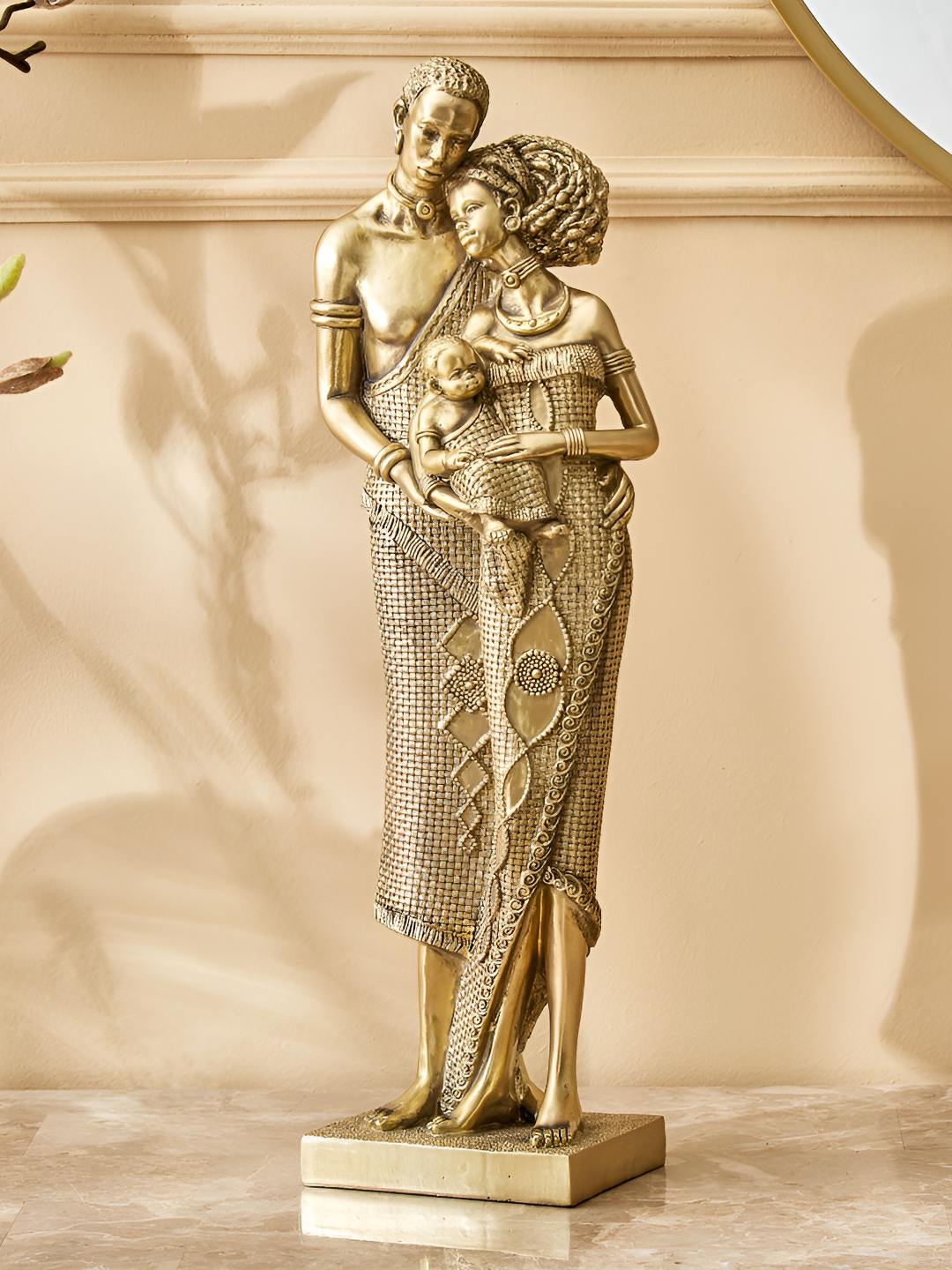 

Home Centre Gold Toned & Black Textured Figurine Showpiece