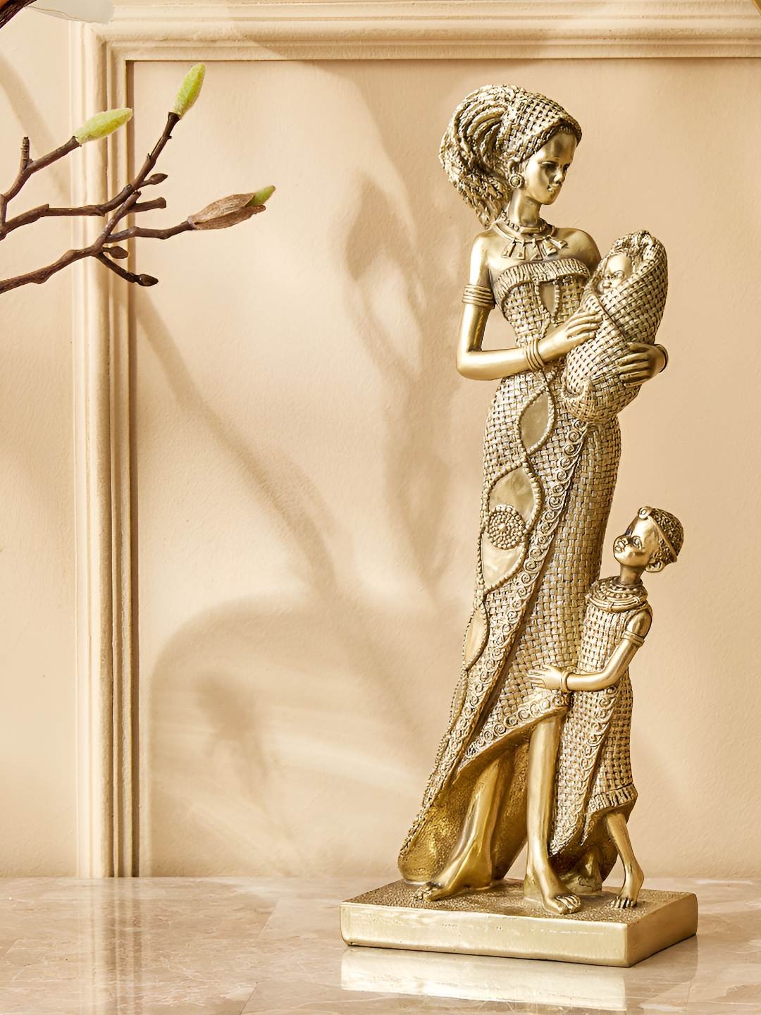 

Home Centre Gold Toned Textured Figurine Showpiece