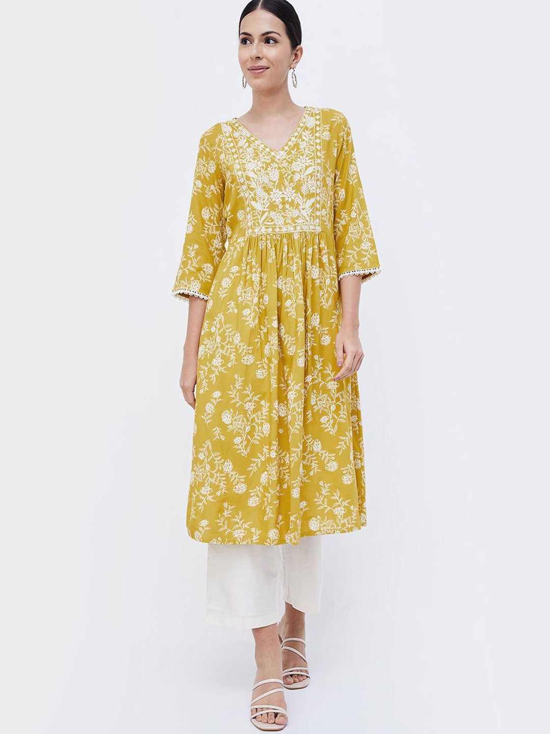 

Melange by Lifestyle Floral Printed V-Neck Thread Work Pleated A-Line Kurta, Yellow