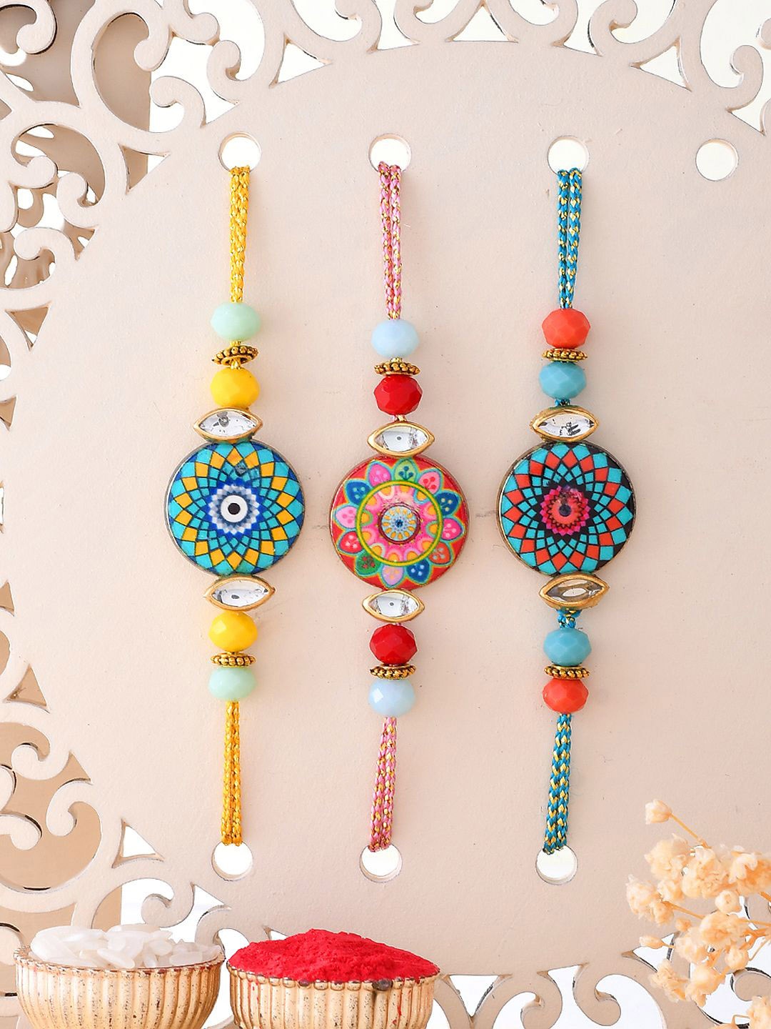 

Aapno Rajasthan Set of 3 Thread Rakhis with Roli Chawal & Greetings Card, Yellow