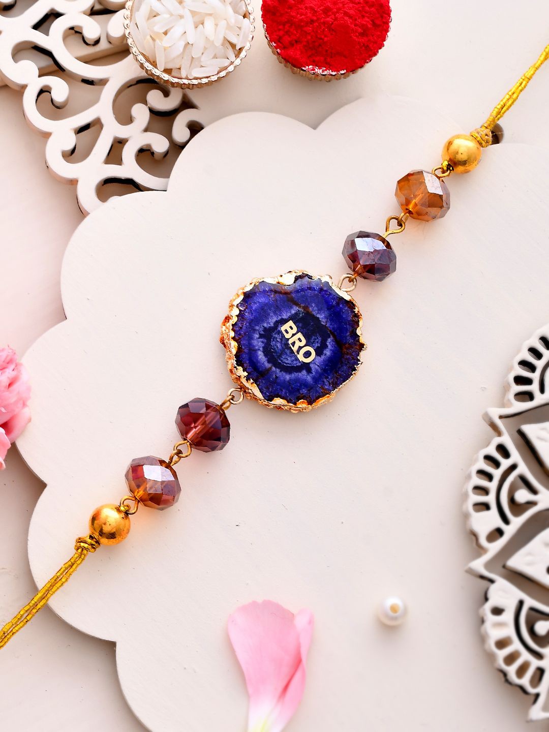 

Aapno Rajasthan Beaded Thread Rakhi with Roli Chawal & Greetings Card, Yellow