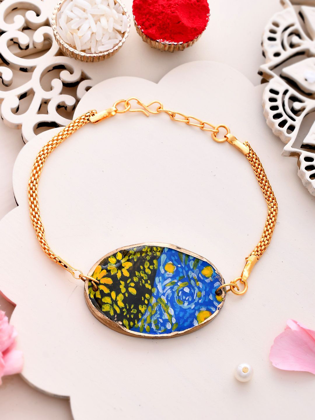 

Aapno Rajasthan Flower Wraparound Rakhi with Roli Chawal & Greetings Card, Gold