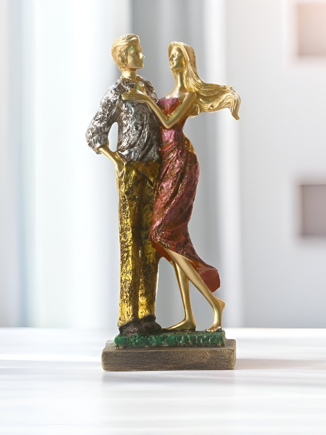 

BECKON VENTURE Gold Toned & Red Textured Figurine Showpiece