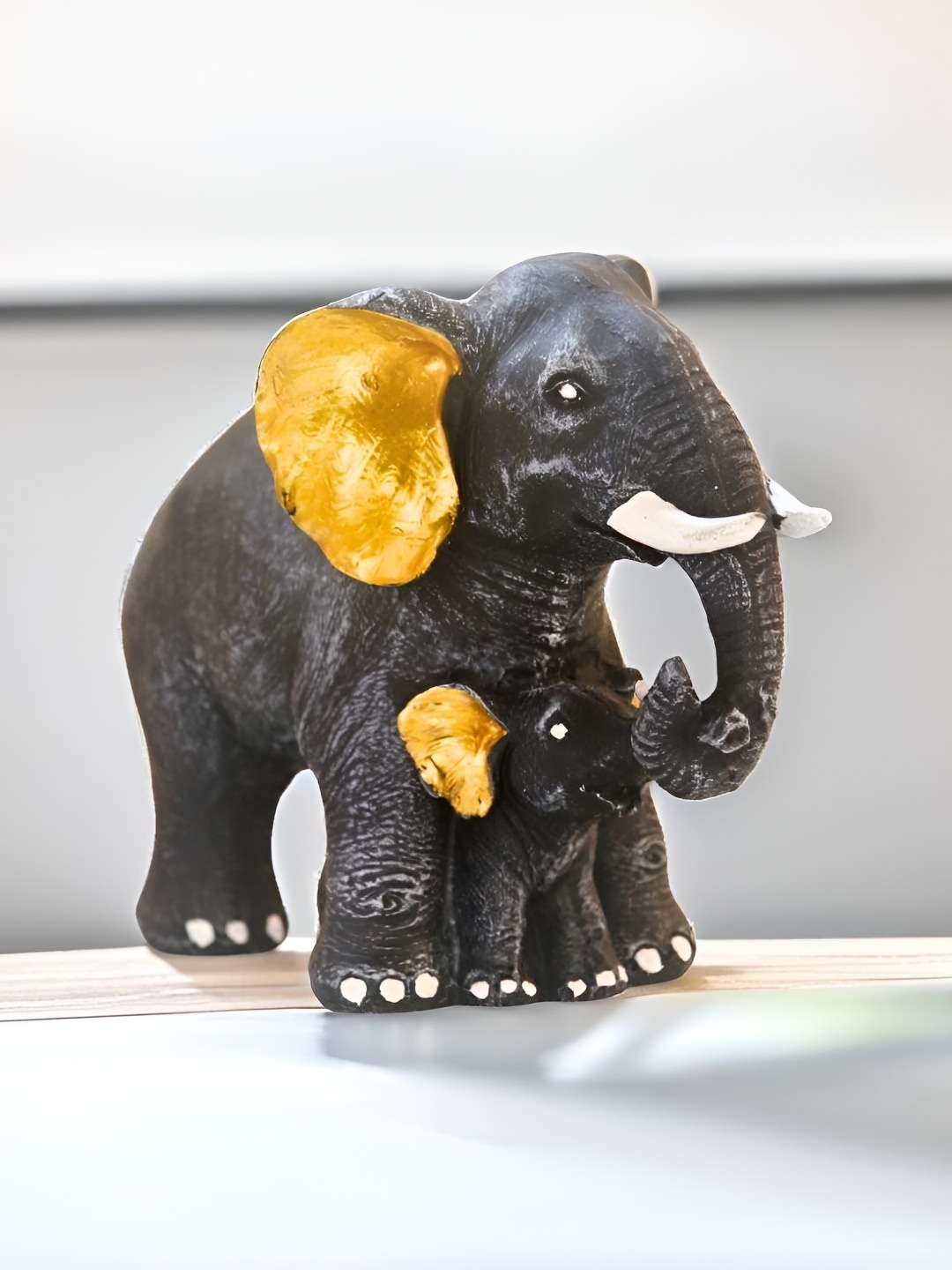 

BECKON VENTURE Black & Yellow Elephant Figurine Showpiece