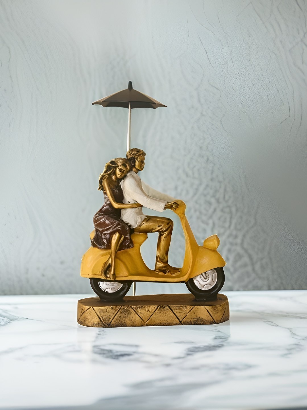 

BECKON VENTURE Gold toned & White Couple On Bike Figurine Showpiece