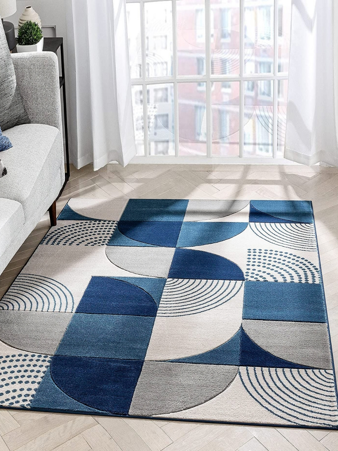 

Safiya Carpet Blue & White Geometric Printed Hand-Tufted Rectangle Shaped Woollen Carpet