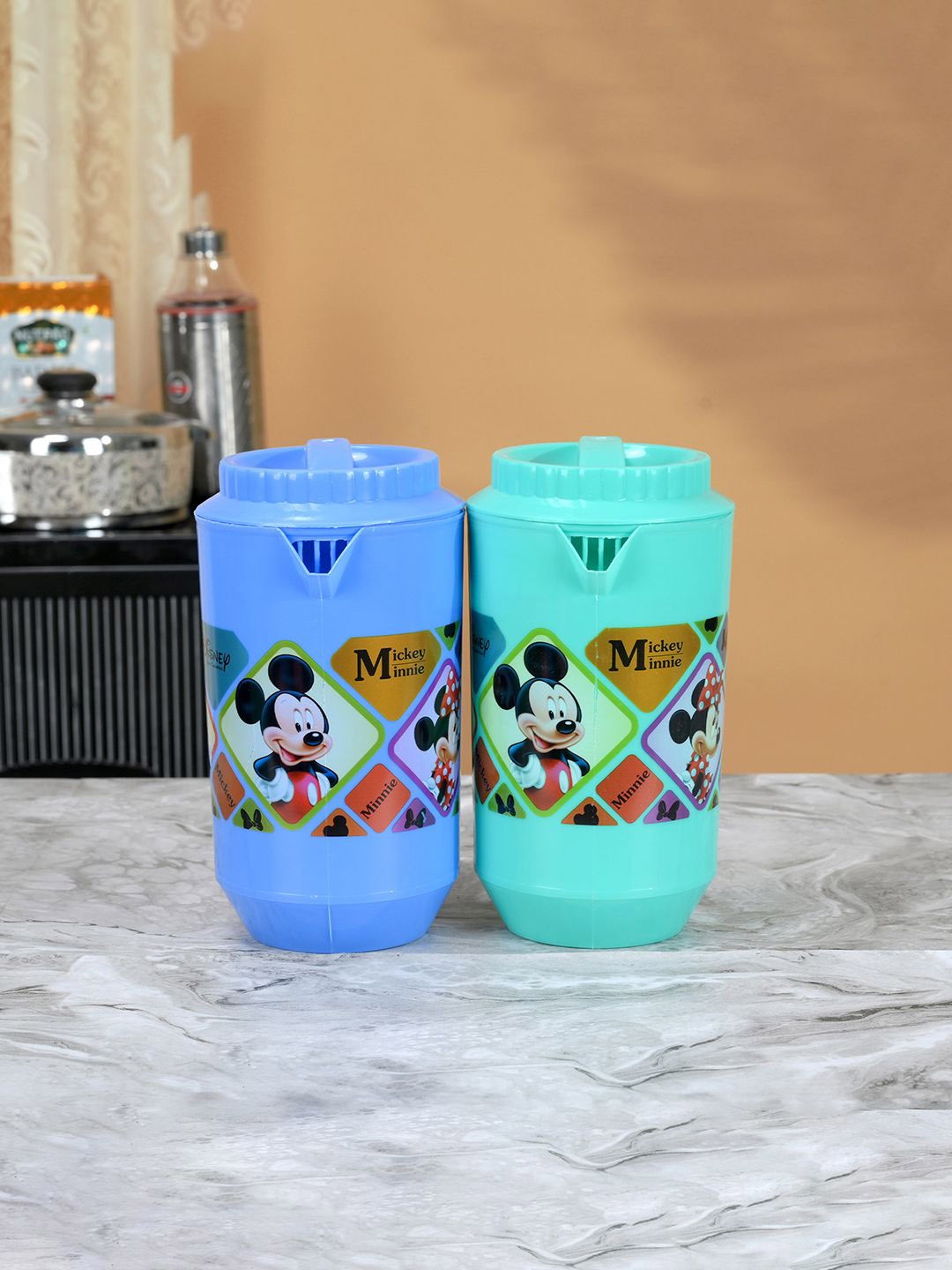 

Kuber Industries Blue & Green 2 Pieces Printed Water Jugs 2 L Each