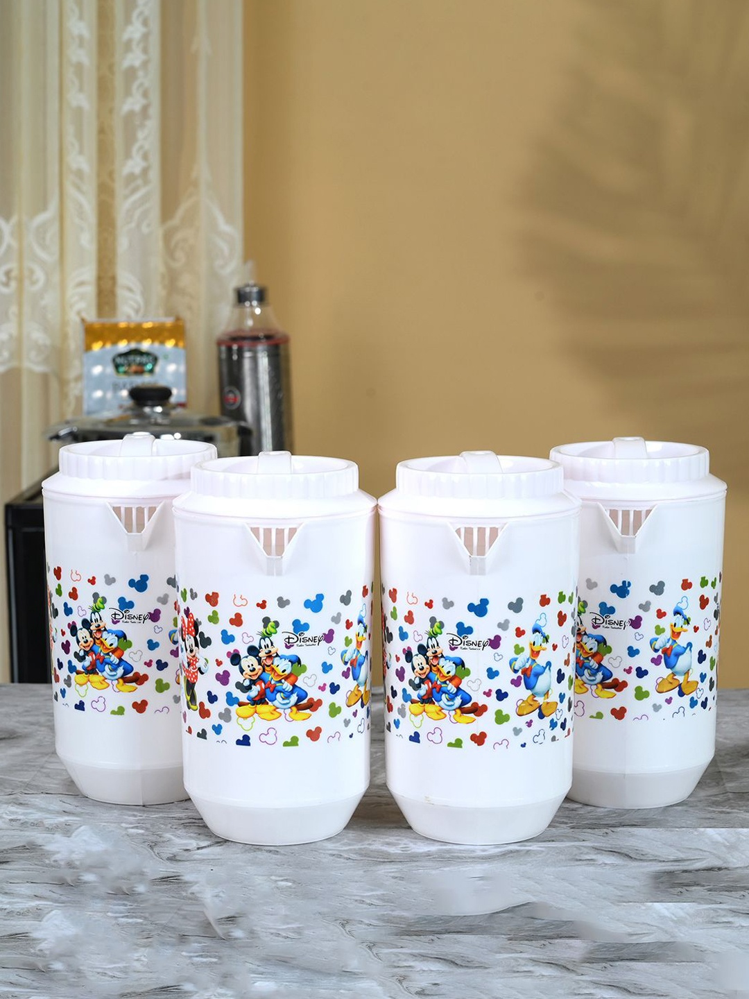 

Kuber Industries White & Blue 4 Pieces Printed Plastic Water Jugs