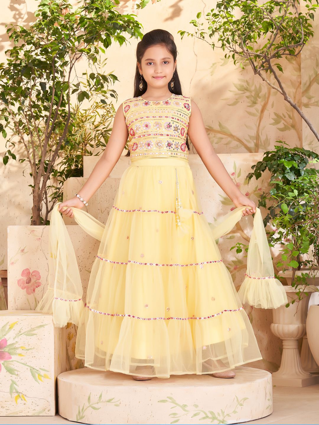 

BAESD Girls Embellished Mirror Work Net Ready to Wear Lehenga & Blouse With Dupatta, Yellow