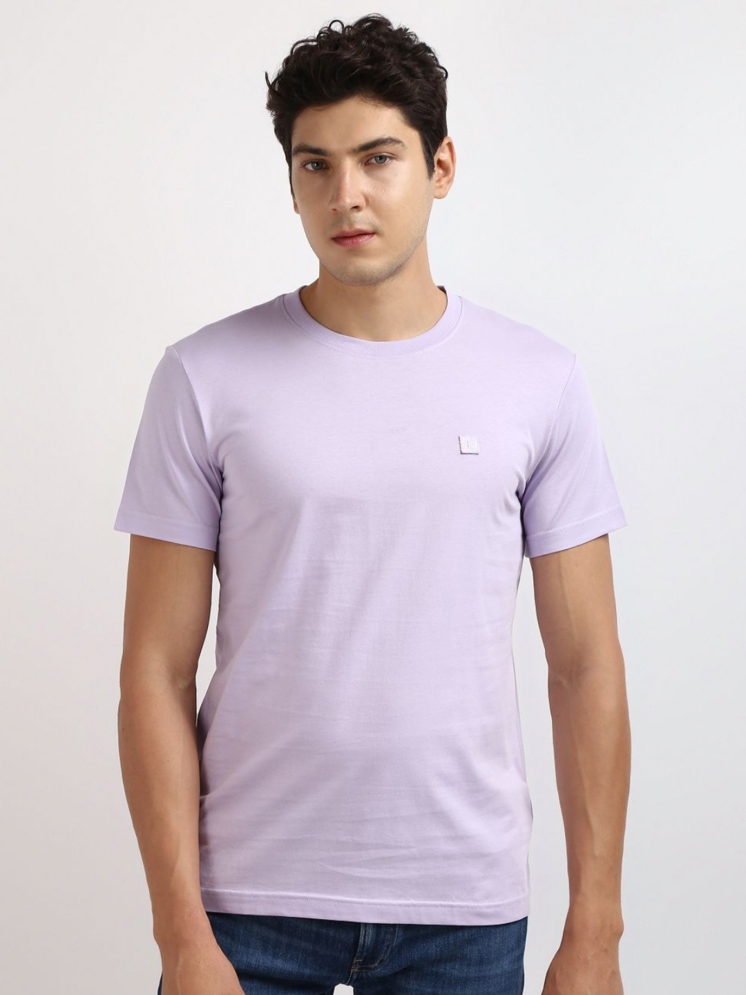 

Calvin Klein Jeans Men Solid Round Neck Cotton T-shirt, Purple