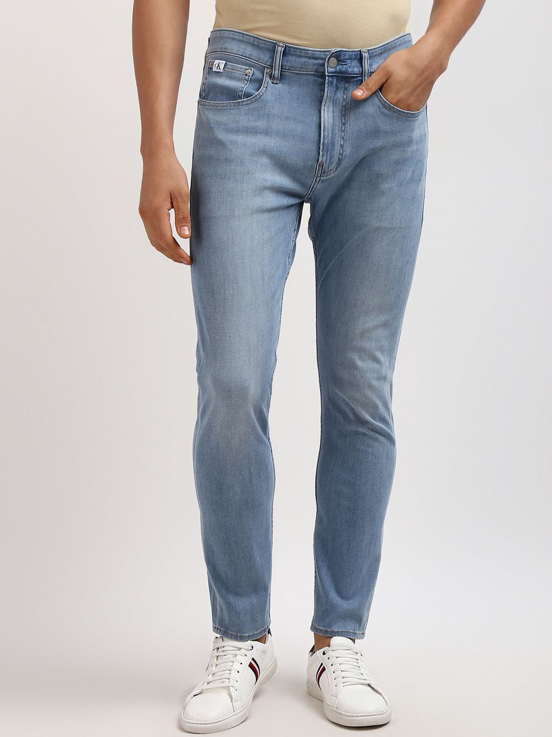 

Calvin Klein Men Tapered Fit Low Distress Heavy Fade Jeans, Blue