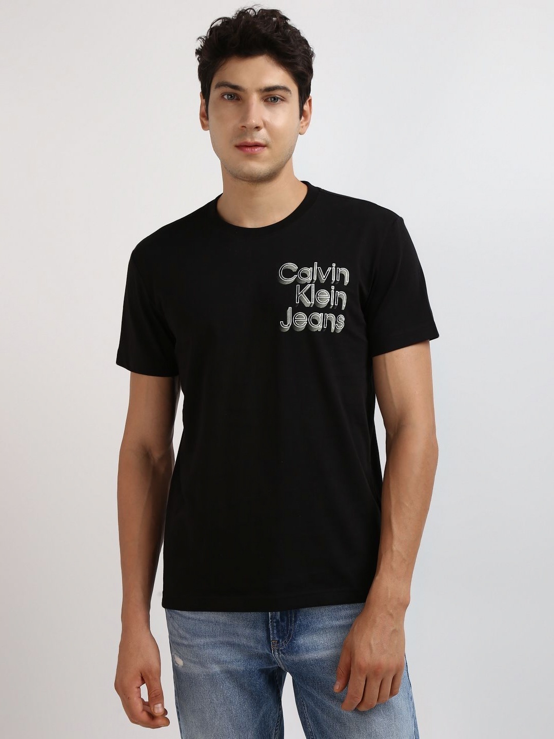

Calvin Klein Jeans Men Solid Round Neck Cotton T-shirt, Black