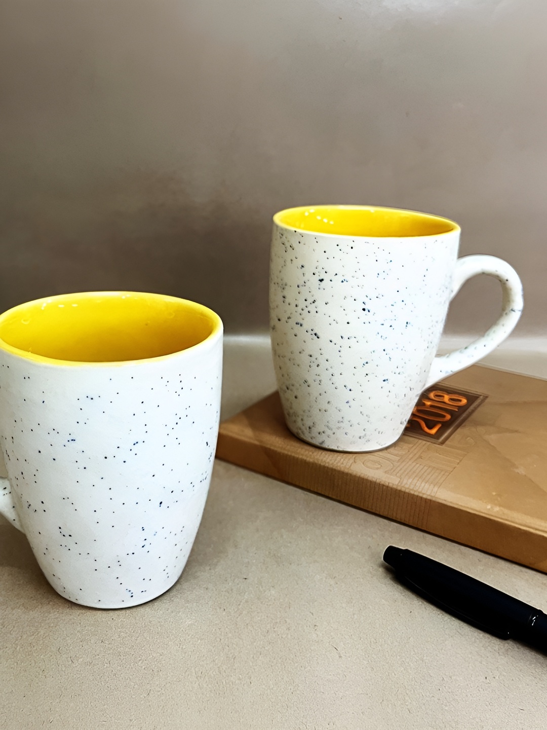 

The Artisan Emporium White & Yellow 2 Pieces Printed Glossy Ceramic Mugs 350 ml Each
