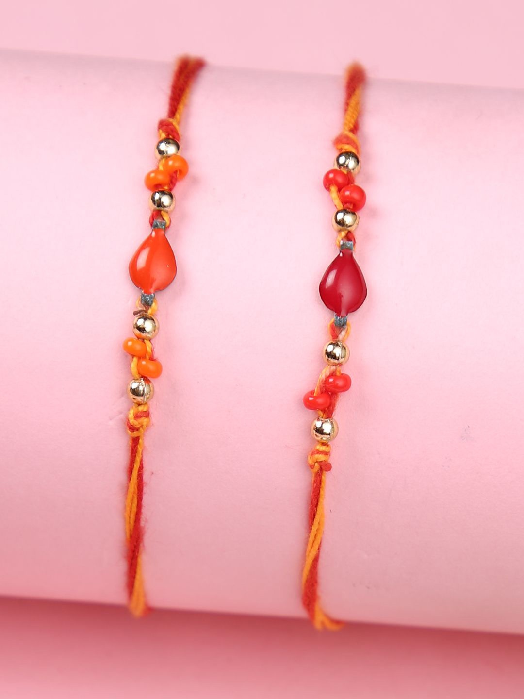 

Aapno Rajasthan Set Of 2 Beaded Thread Rakhi With Roli Chawal & Greeting Card, Orange