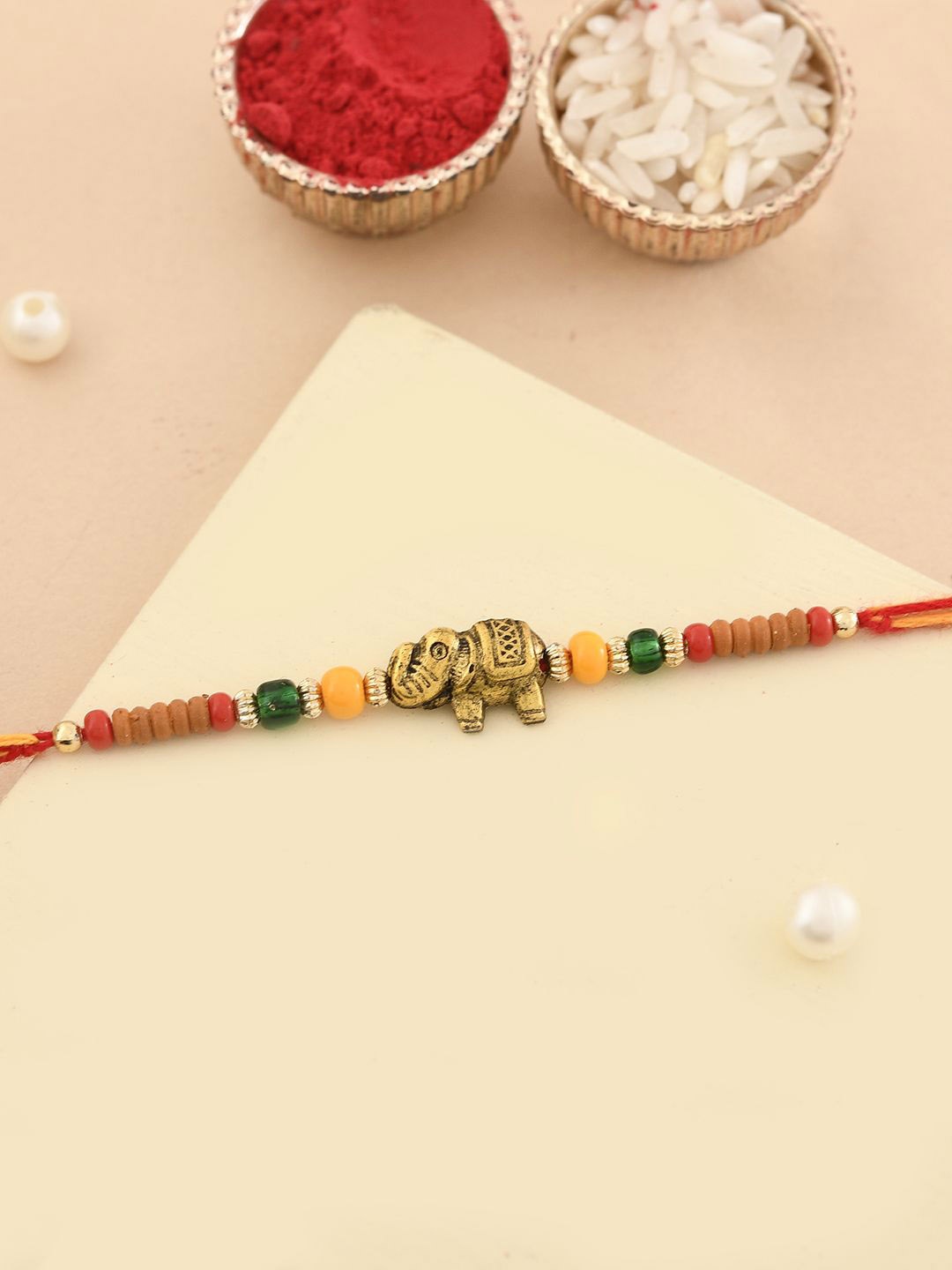 

Aapno Rajasthan Unisex Little Ganesha Beaded Thread Rakhi, Gold