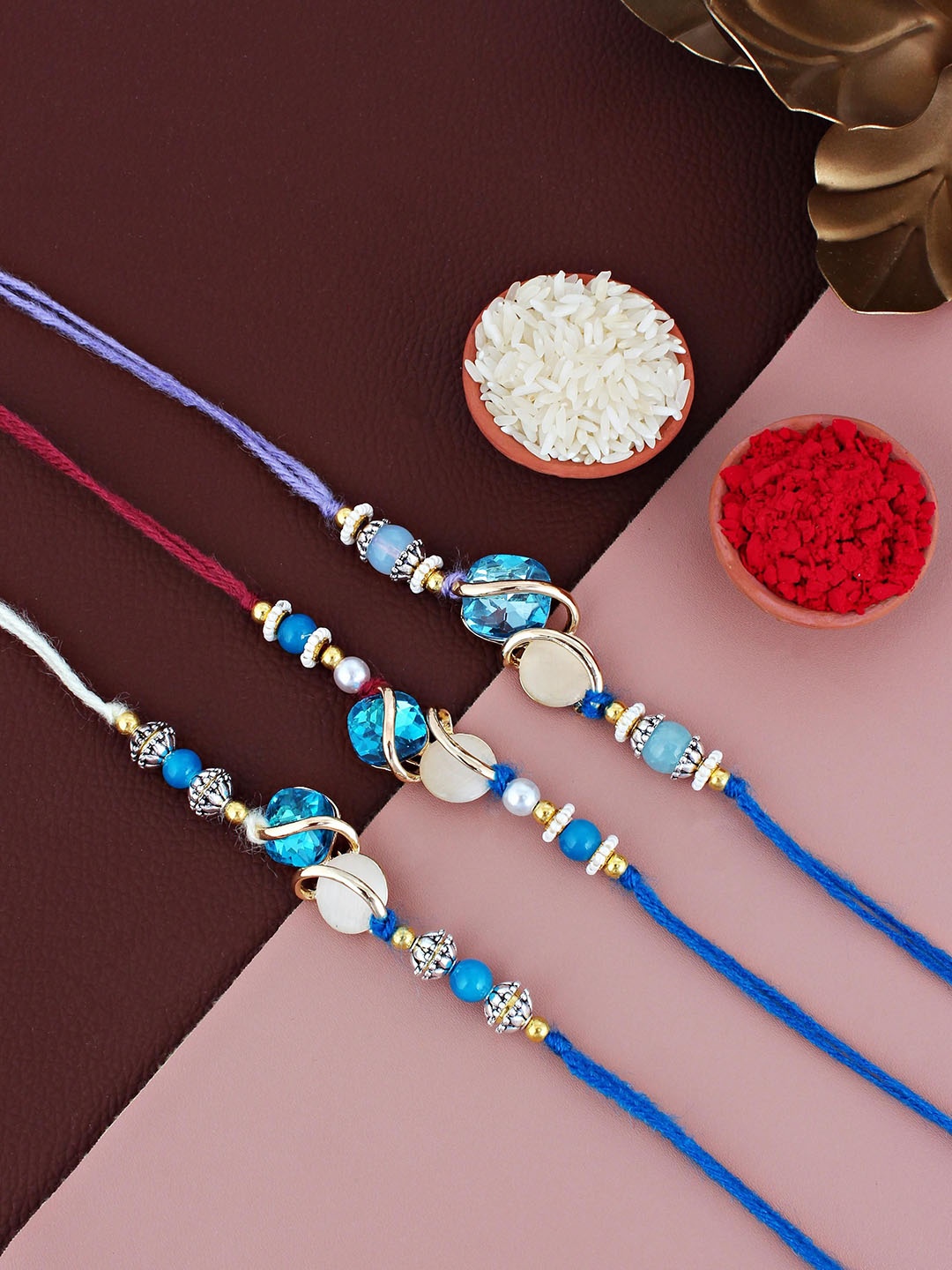 

LUCKY JEWELLERY Set Of 3 Gold Plated Stone-Studded Rakhi With Roli Chawal & Greeting Card