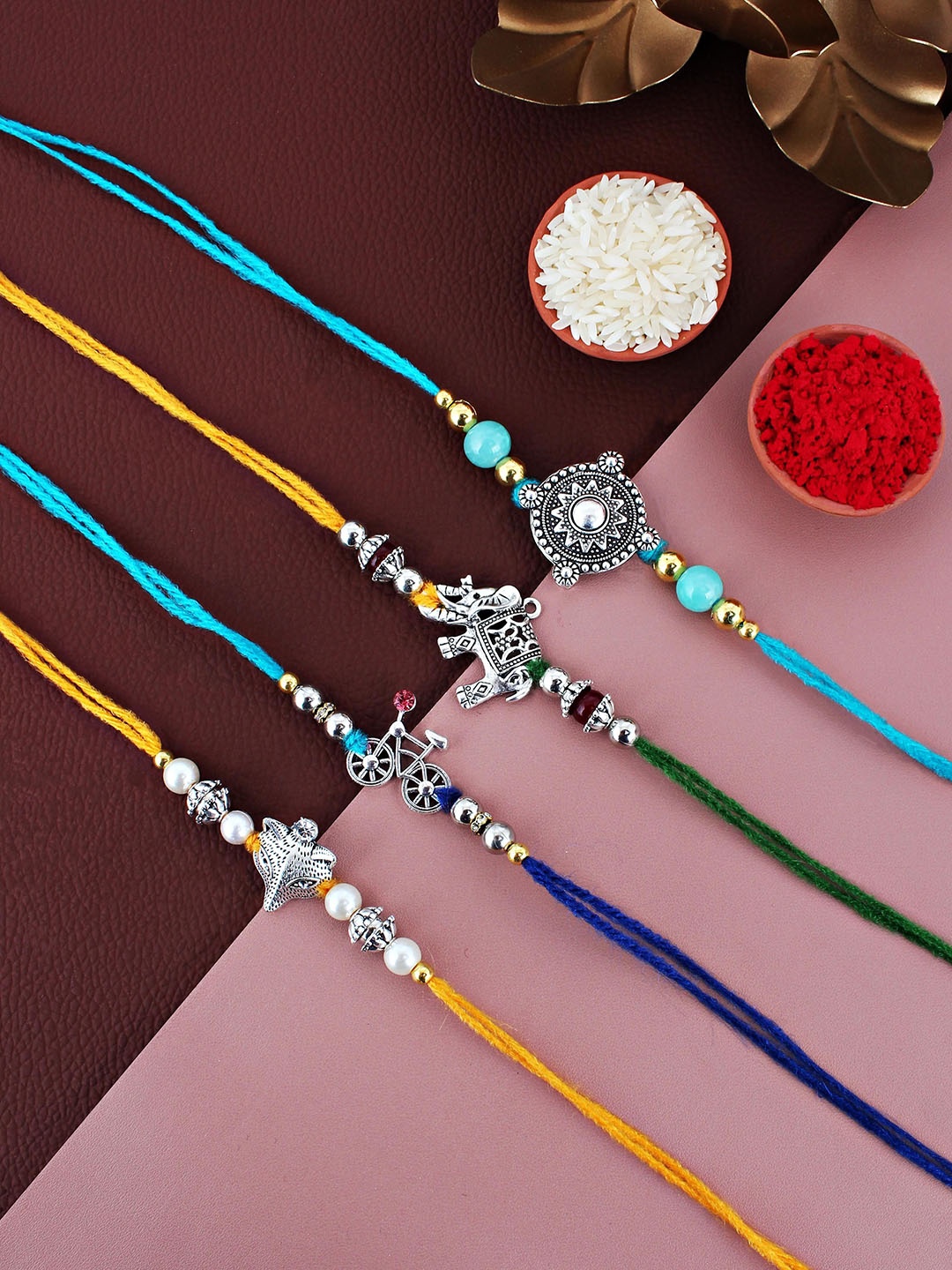 

LUCKY JEWELLERY Set Of 4 Beaded German Silver Rakhis with Roli Chawal & Greeting Card