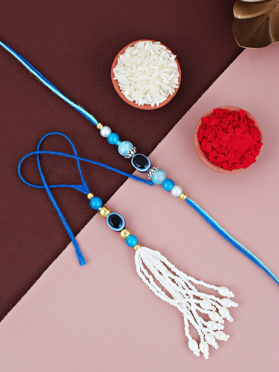 

LUCKY JEWELLERY Evil Eye & Lumba Bhaiya Bhabhi Rakhis With Roli Chawal & Greeting Card, Blue