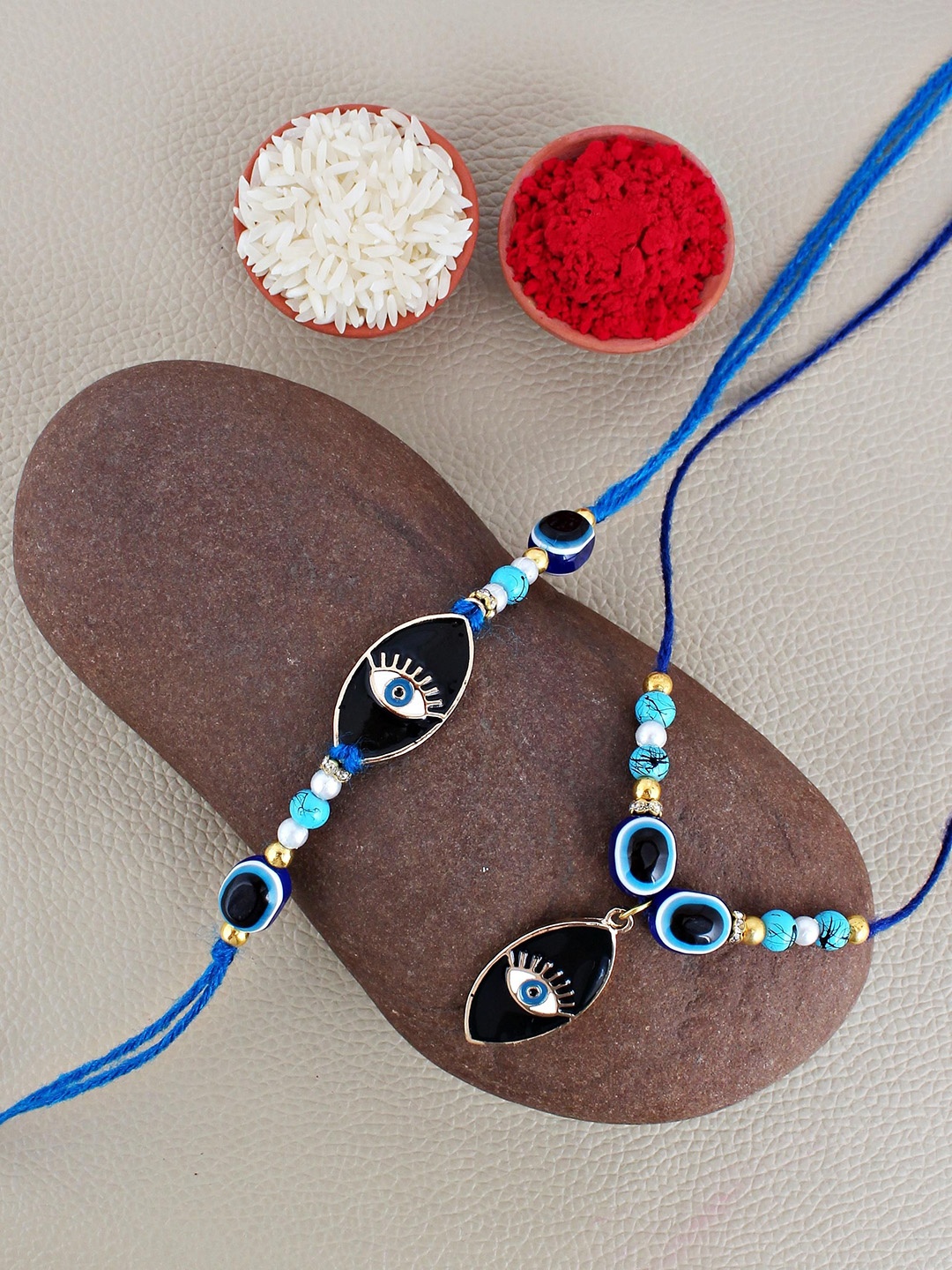

LUCKY JEWELLERY Evil Eye & Lumba Bhaiya Bhabhi Rakhis With Roli Chawal & Greeting Card, Silver