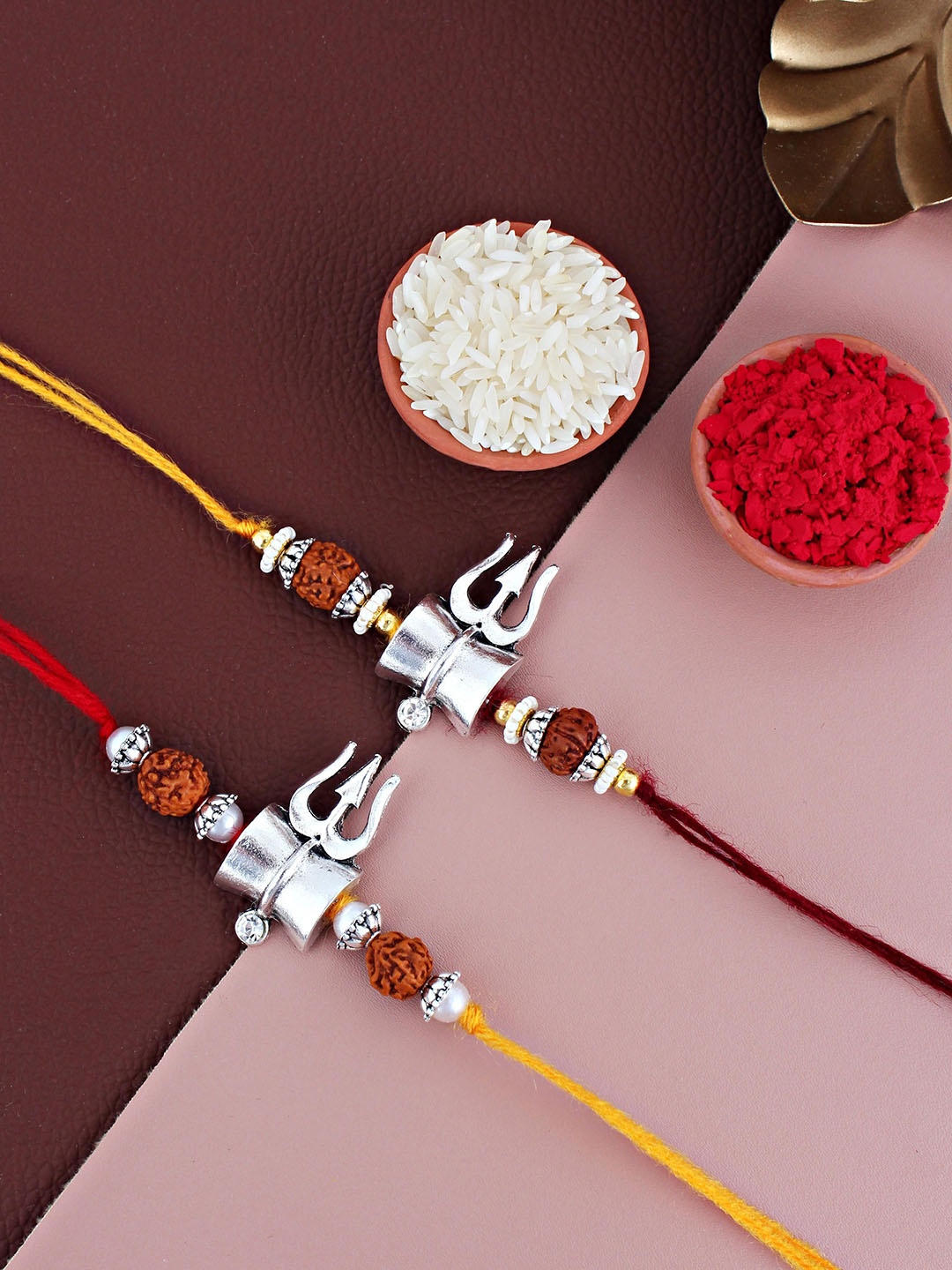 

LUCKY JEWELLERY Set Of 2 Oxidised German Silver Shiva Rakhis With Roli Chawal