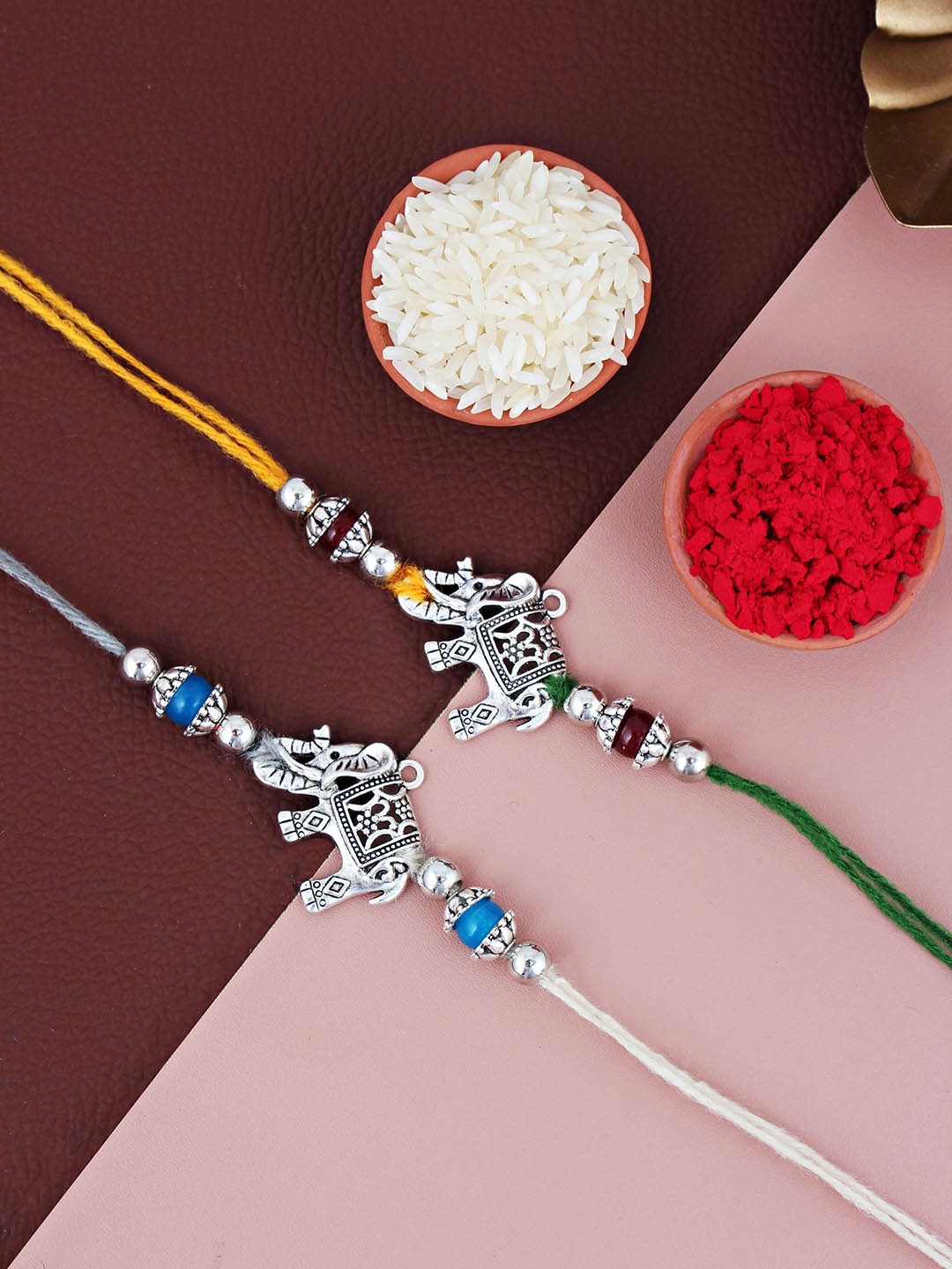 

LUCKY JEWELLERY Set Of 2 Elephant Thread Rakhis With Roli Chawal, Yellow