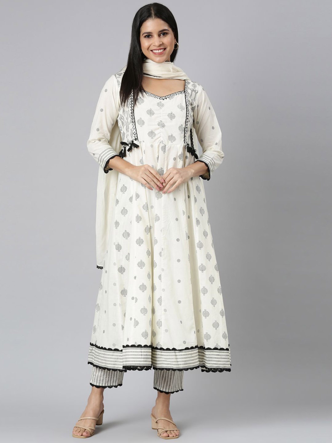 

Neerus Ethnic Motifs Printed Jute Cotton Anarkali Kurta with Trousers & Dupatta, Cream