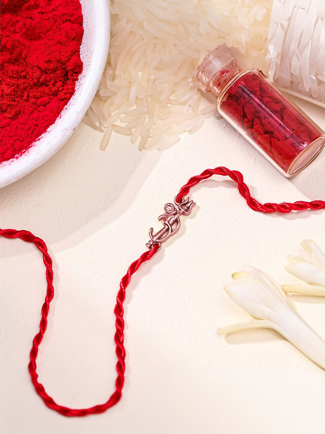 

Zavya 925 Sterling Silver Om & Thrishul Wraparound Brother Rakhi, Rice & Roli Set, Rose gold