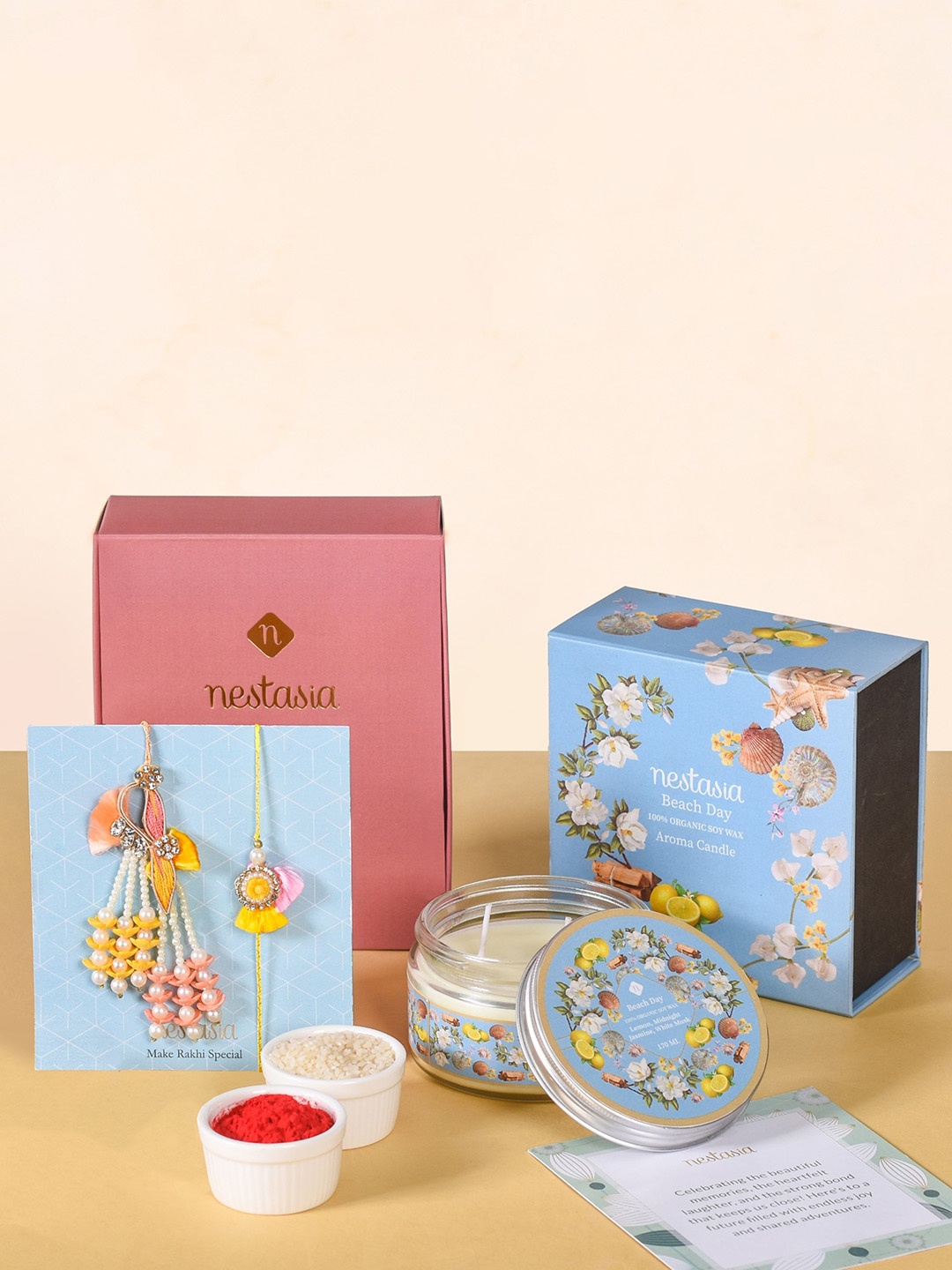 

Nestasia Set Of 2 Lumba Rakhi With Scented Candle Jar Gift Set, Yellow