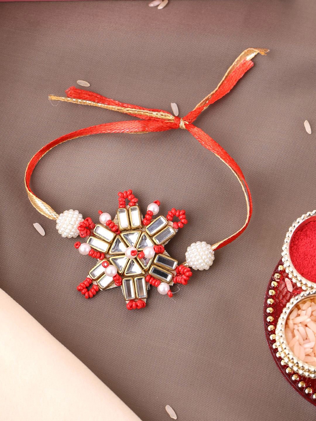 

PANASH Set Of 2 Gold-Plated Beaded Rakhi And LED Cushion With Roli Chawal