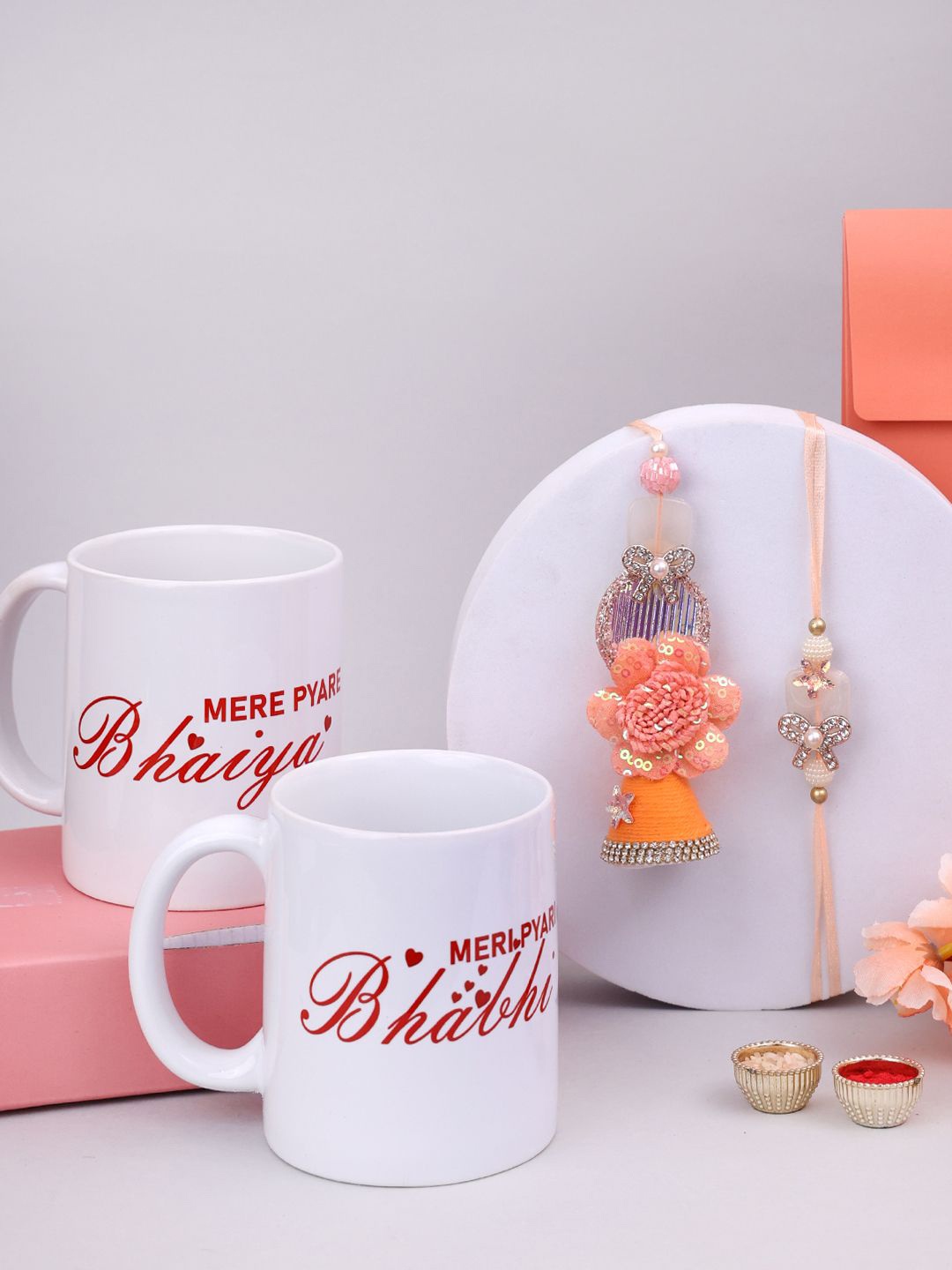 

PANASH Set Of 4 Gold-Plated Stone-Studded Rakhis And Printed Mugs With Roli Chawal