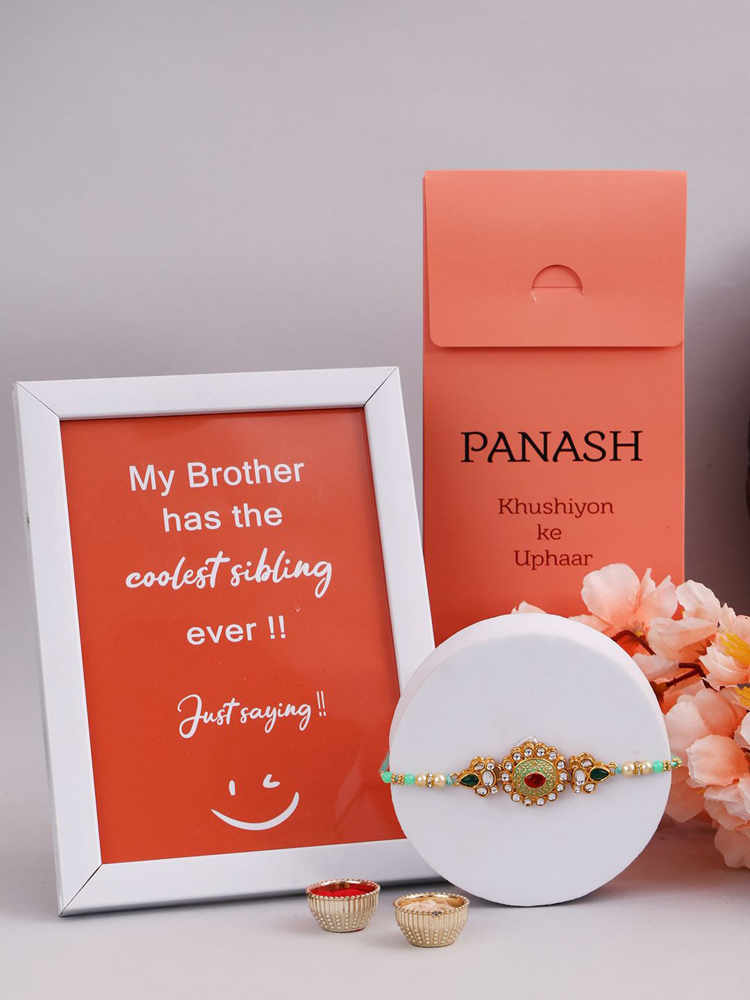 

PANASH Set Of 2 Gold-Plated Stone Studded Rakhi With Photo Frame And Roli Chawal