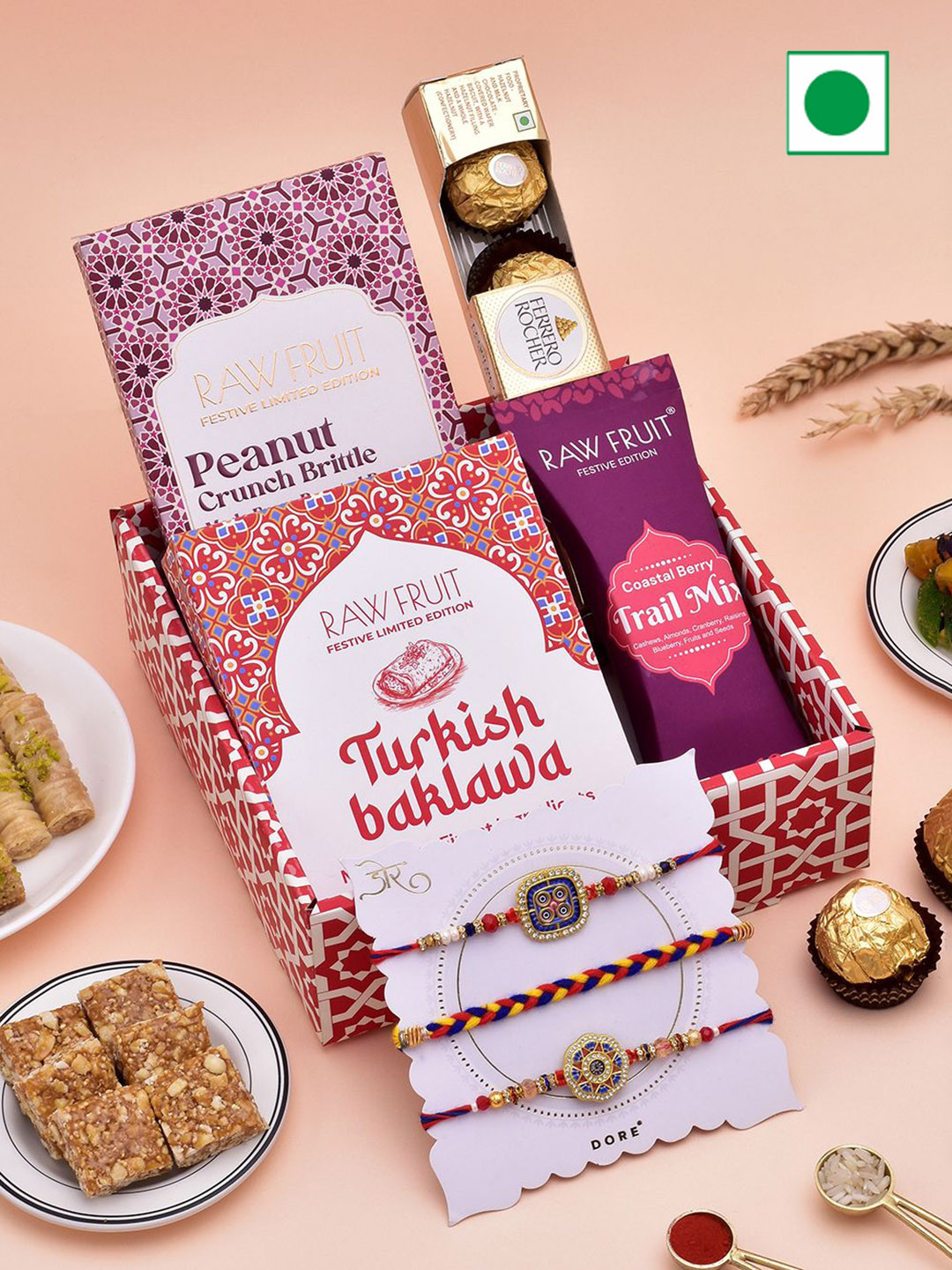 

RawFruit Hamper Tray Dry Fruit, Chocolate, Peanut Brittle With 3 Rakhi, Red