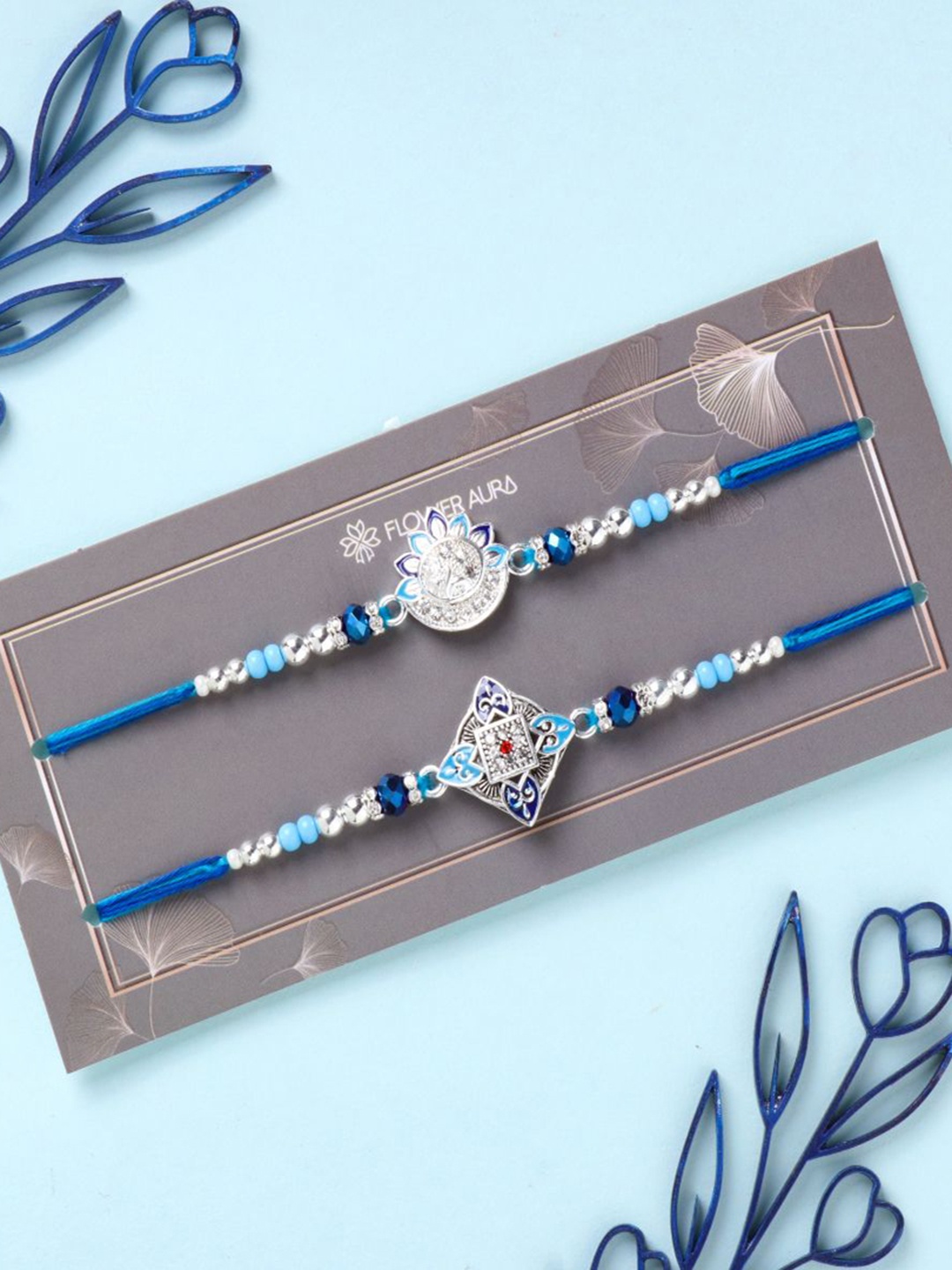 

Floweraura Stone Studded & Beaded Thread Rakhi With Roli Chawal, Blue