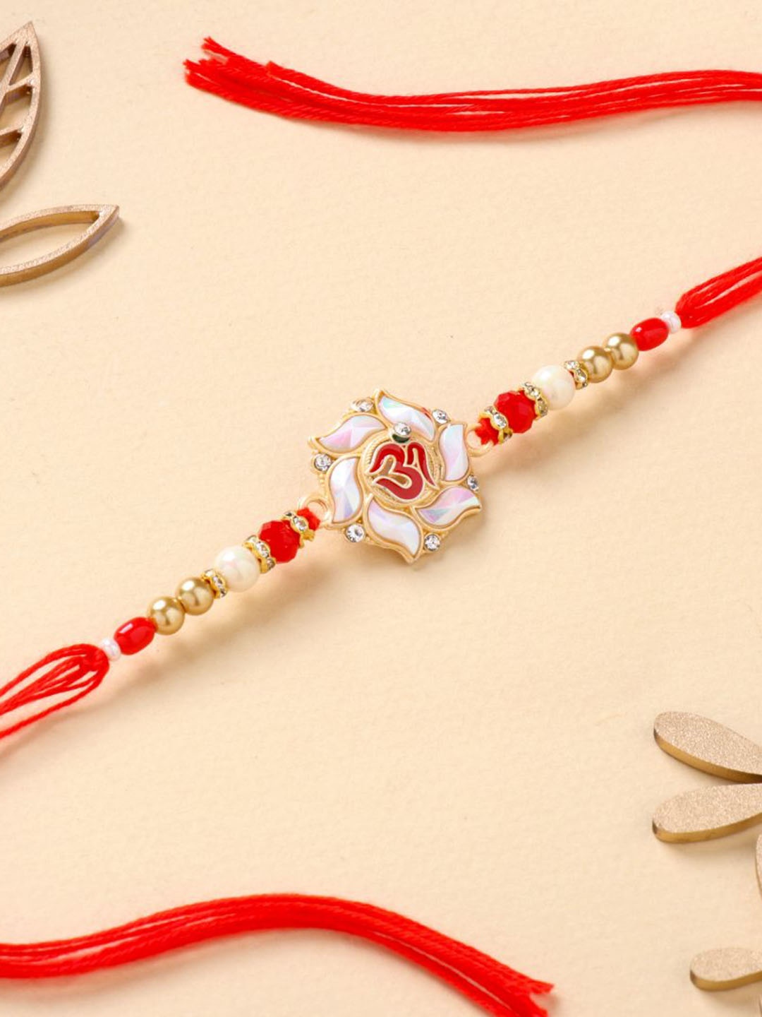 

Floweraura Beaded Om Charm Thread Rakhi With Roli Chawal, Red