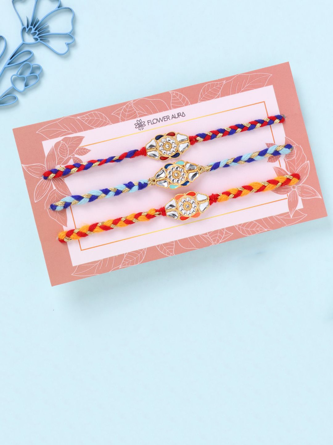 

Floweraura Set Of 3 Mirror Work Thread Rakhis With Roli Chawal, Orange