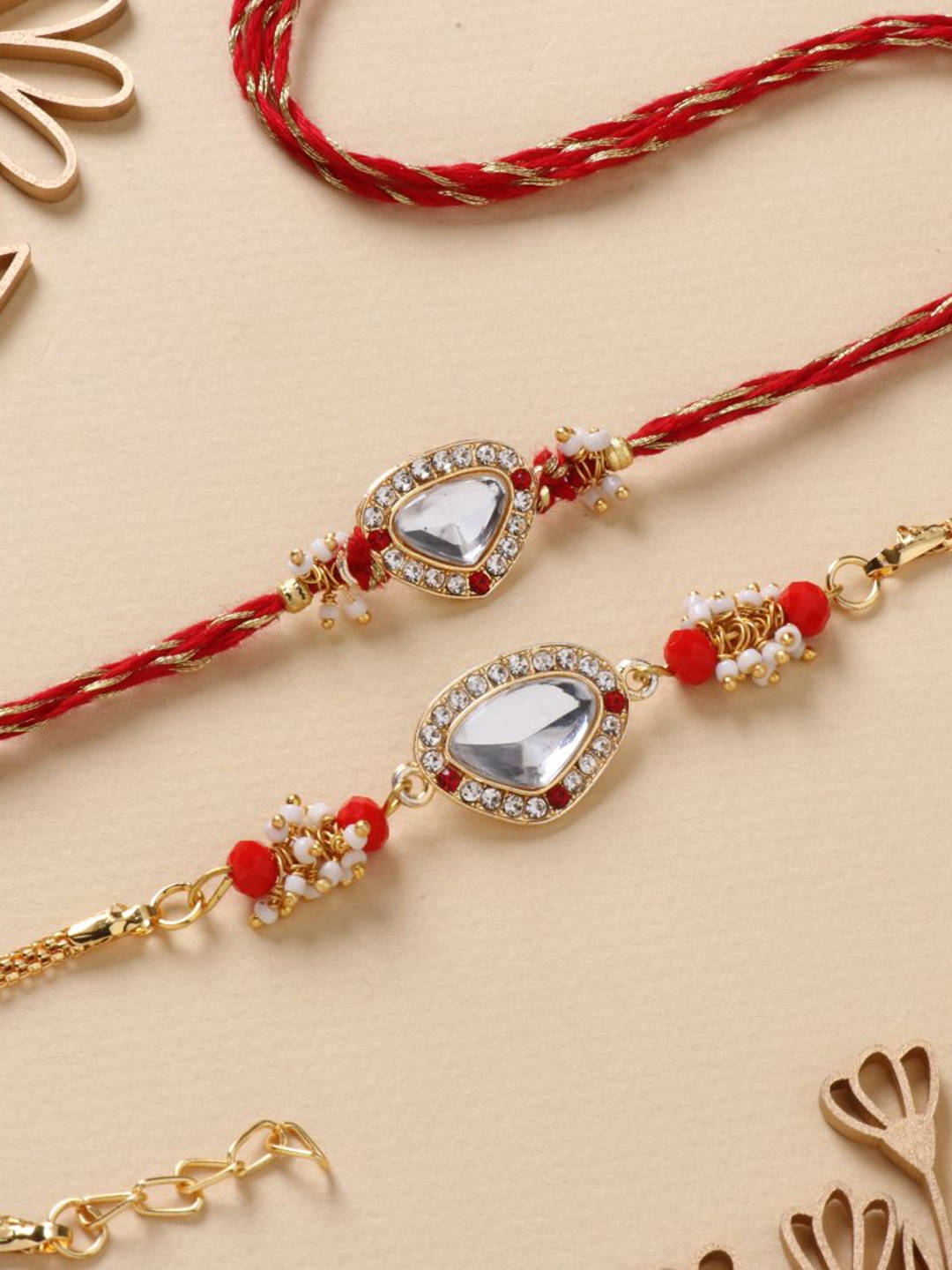 

Floweraura Set Of 2 Stone Studded & Beaded Thread Rakhis With Roli Chawal, Red