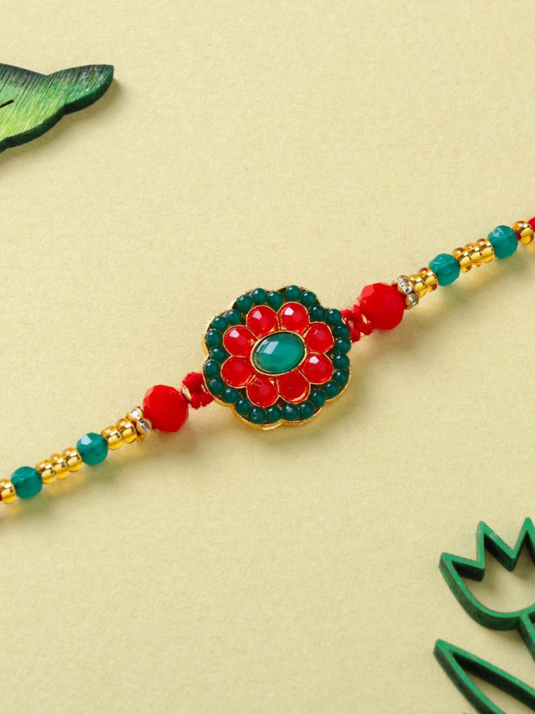 

Floweraura Stone Studded & Beaded Thread Rakhi With Roli Chawal, Red