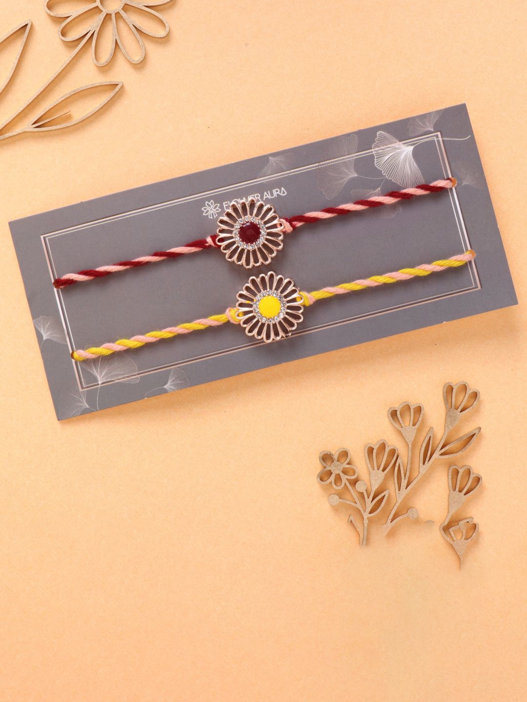 

Floweraura Set Of 2 Stone Studded Floral Charm Thread Rakhi With Roli Chawal, Yellow