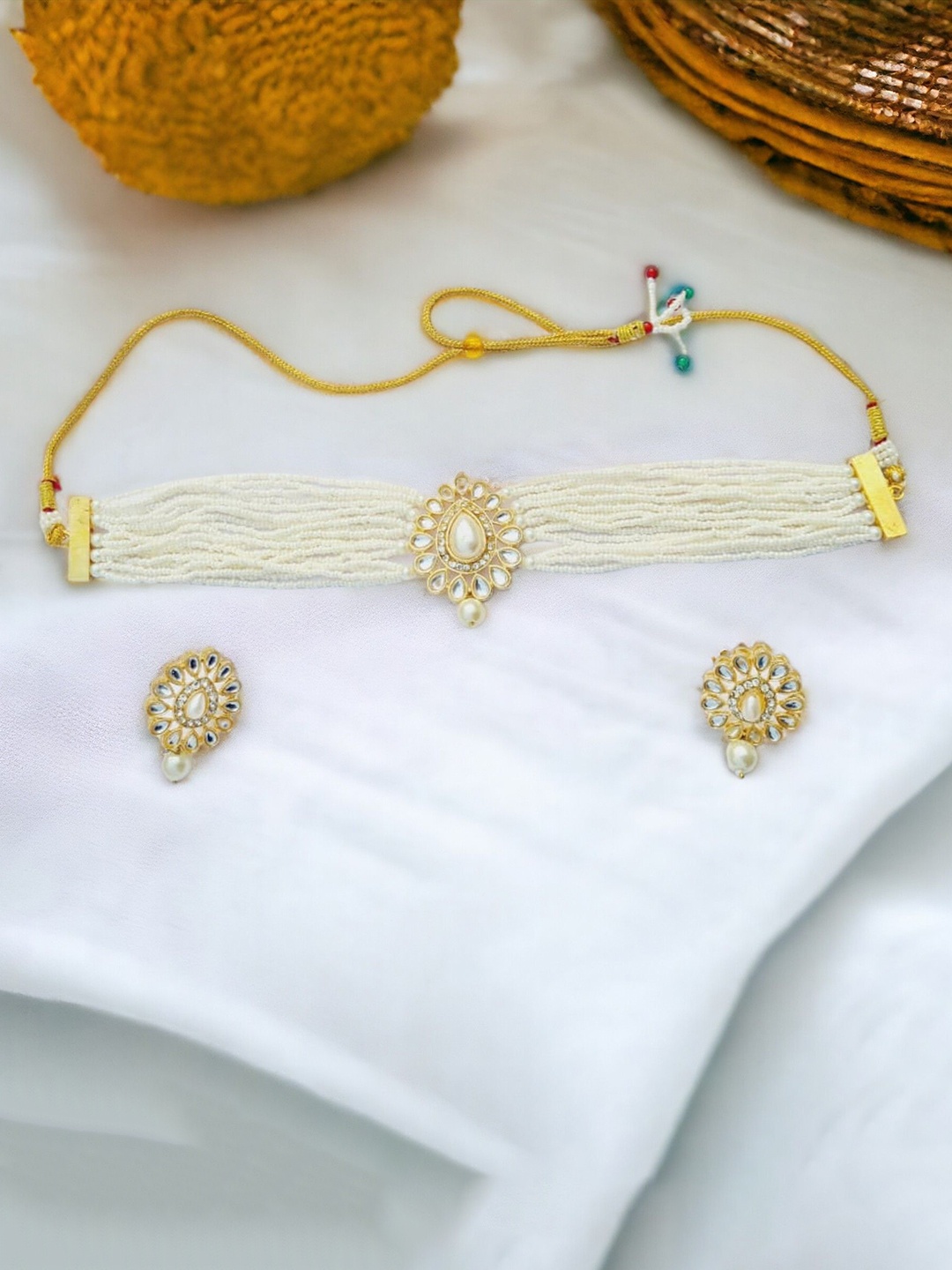 

The Pari Gold Plated Stones Studded & Beaded Traditional Jewellery Set