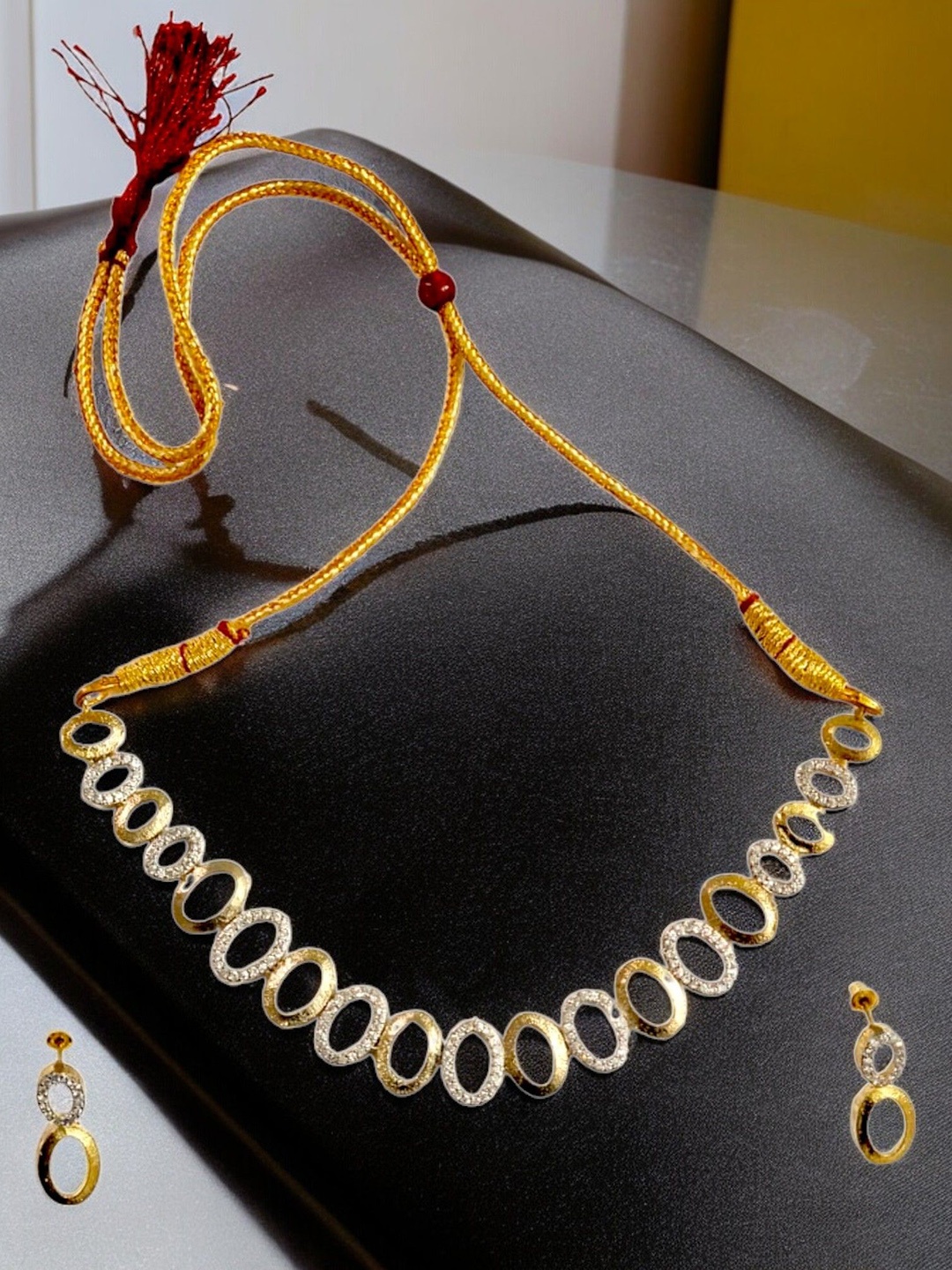 

The Pari Gold Plated Stones Studded Traditional Jewellery Set