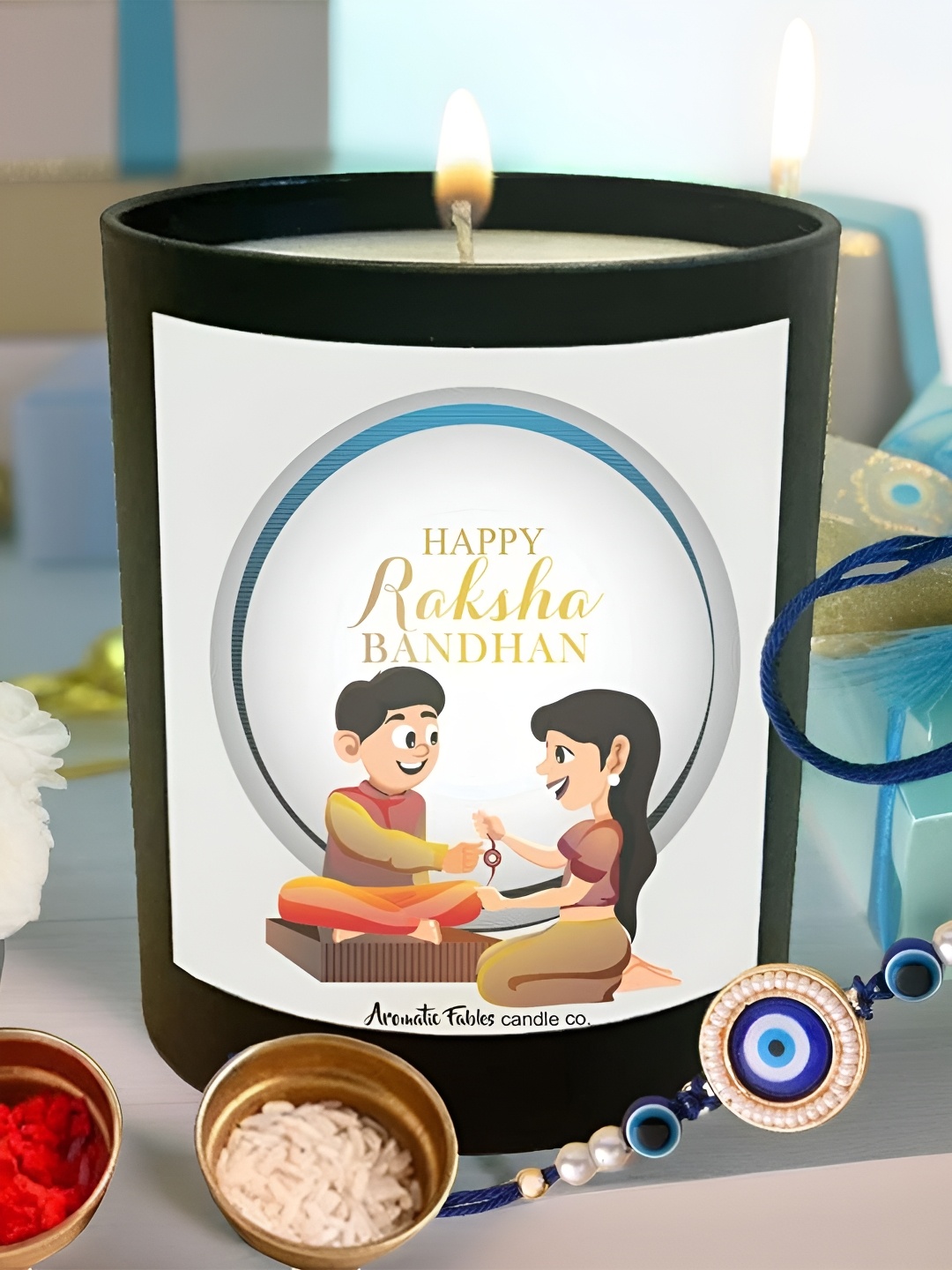 

Aromatic Fables Set Of 2 Rakhi With Ocean Breeze Scented Candle & Roli Chawal, Blue