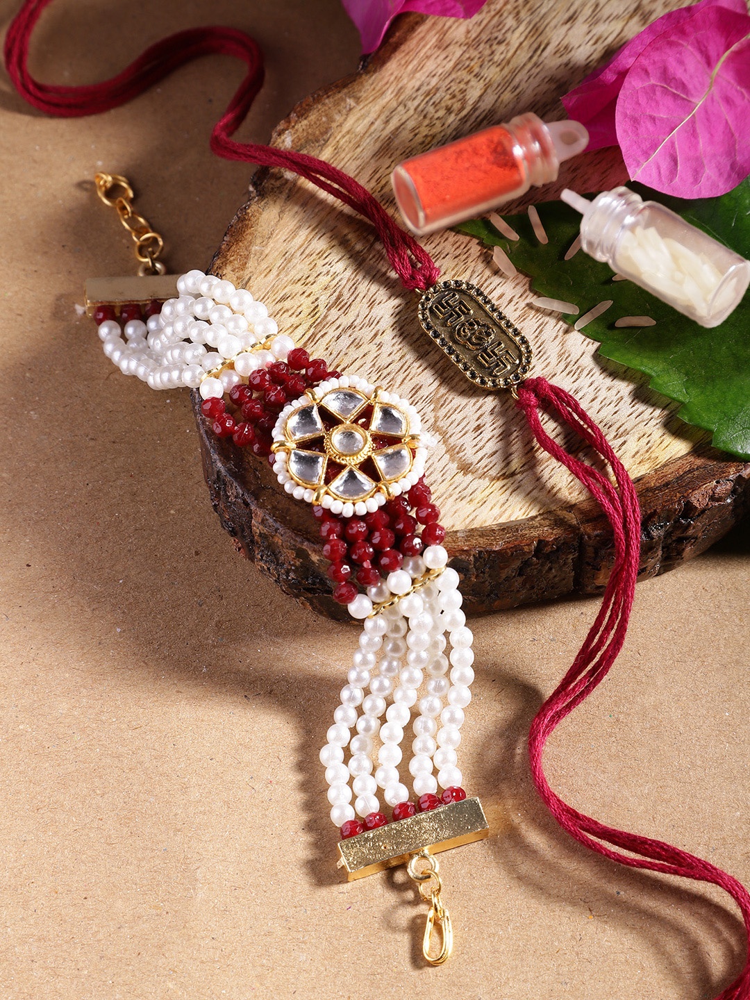 

Anouk Unisex Set of 2 Beaded Bhai Bhabhi Rakhis With Roli & Chawal, Maroon