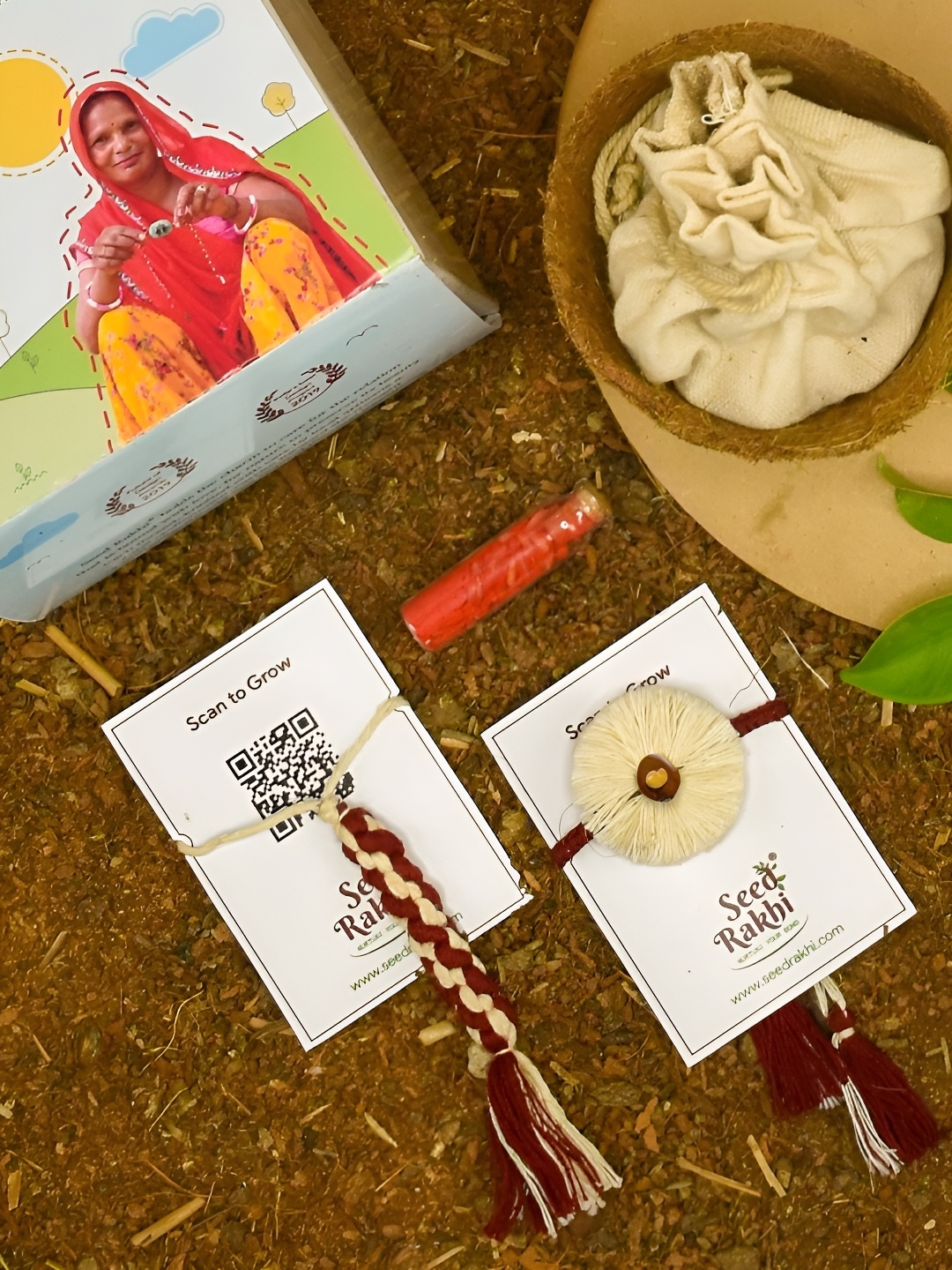 

Indigifts Set Of 2 Seed Rakhi With Planter Manual & Roli, Cream